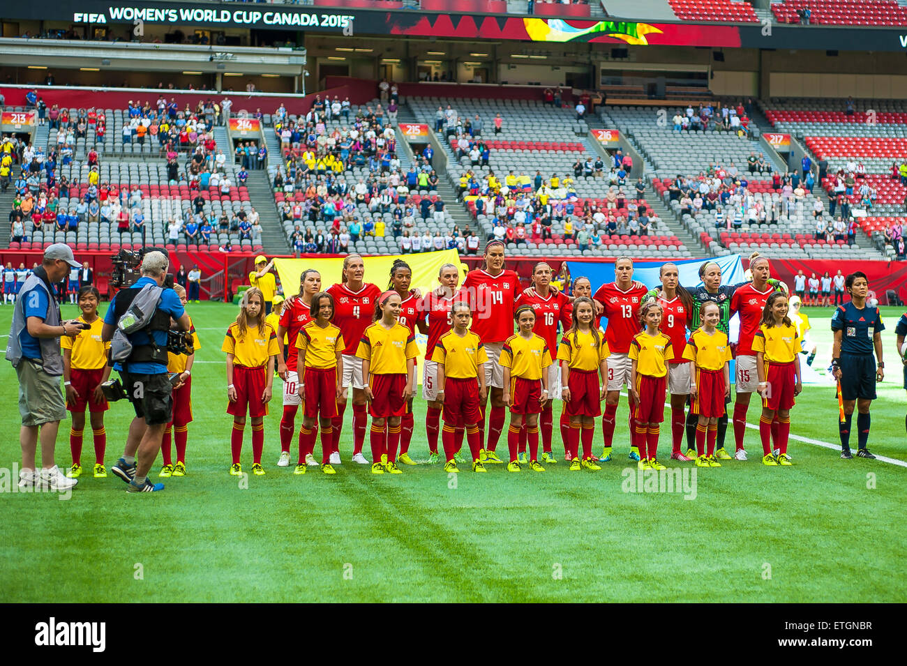Vancouver, Canada - June 12, 2015: Team Switzerland lined up for the national anthems during the opening round match between Switzerland and Ecuador of the FIFA Women's World Cup Canada 2015 at BC Place Stadium. Switzerland won the match 10-1. Stock Photo