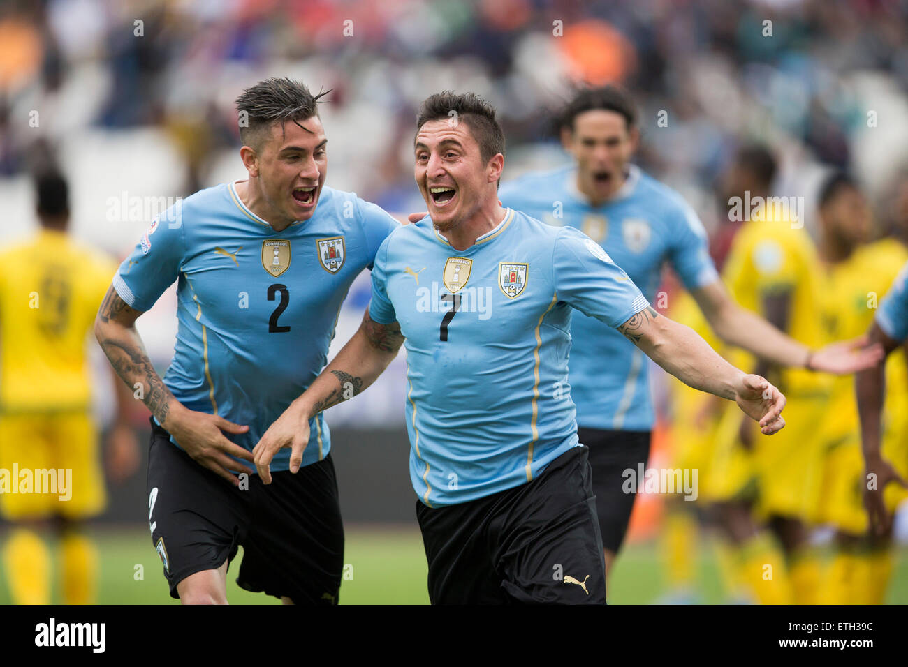 Antofagasta, Chile. 13th June, 2015. Cristian Rodriguez (R) of Uruguay celebrates after scoring during a Group B match between Uruguay and Jamaica at Copa America 2015, in Antofagasta, Chile, on June 13, 2015. Uruguay won 1-0. © Luis Echeverria/Xinhua/Alamy Live News Stock Photo
