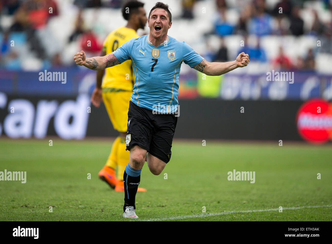 Antofagasta, Chile. 13th June, 2015. Cristian Rodriguez of Uruguay celebrates after scoring during a Group B match against Jamaica at Copa America 2015, in Antofagasta, Chile, on June 13, 2015. Uruguay won 1-0. © Luis Echeverria/Xinhua/Alamy Live News Stock Photo