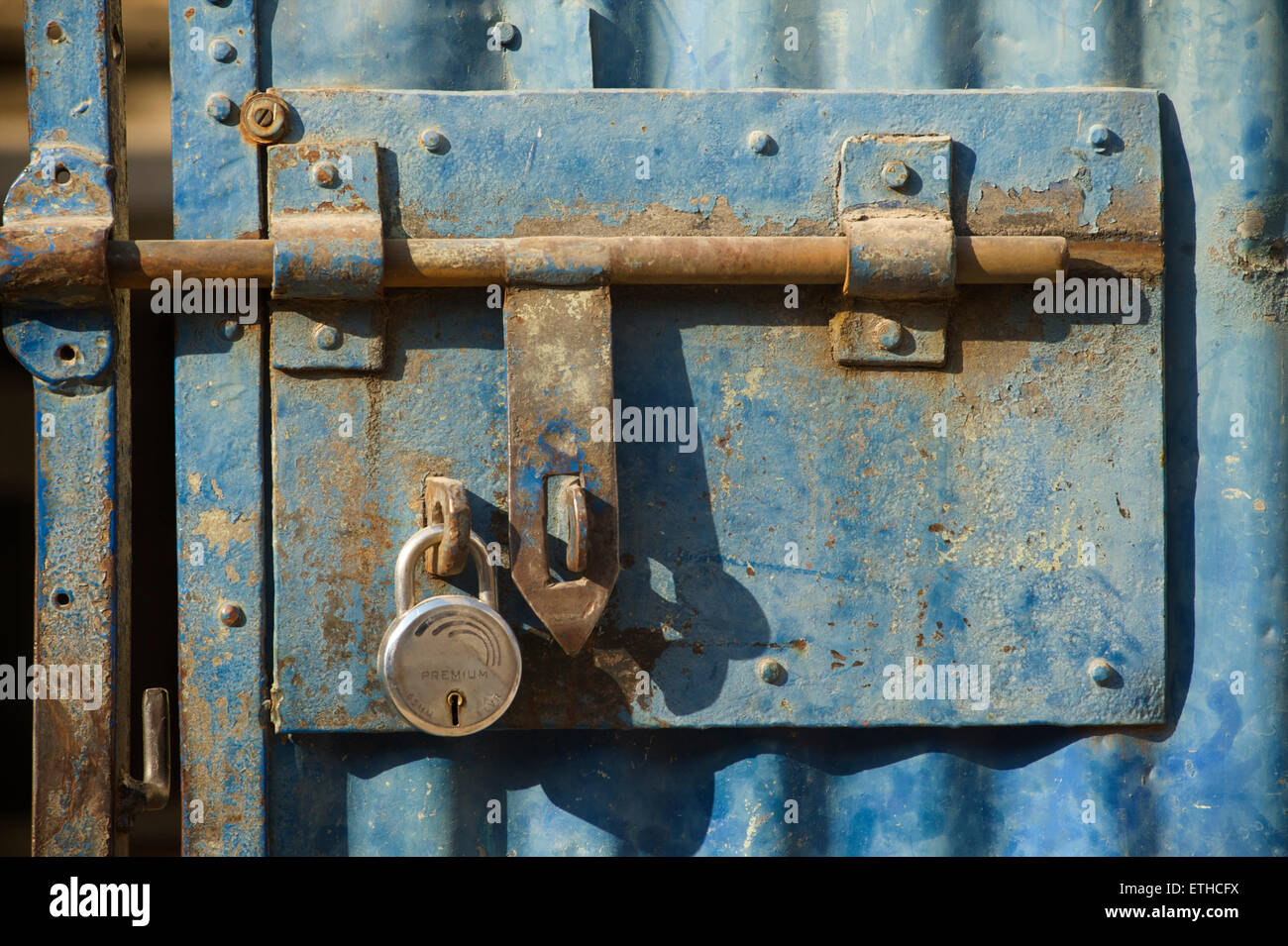 Padlocked steel door, India Stock Photo