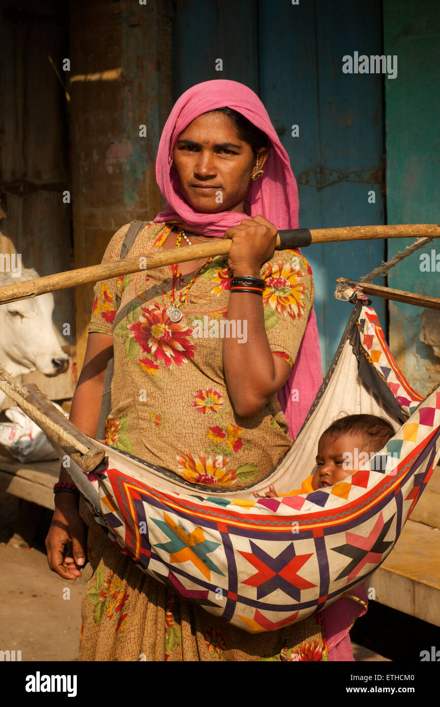 Indian woman carrying baby hi-res stock photography and images - Alamy