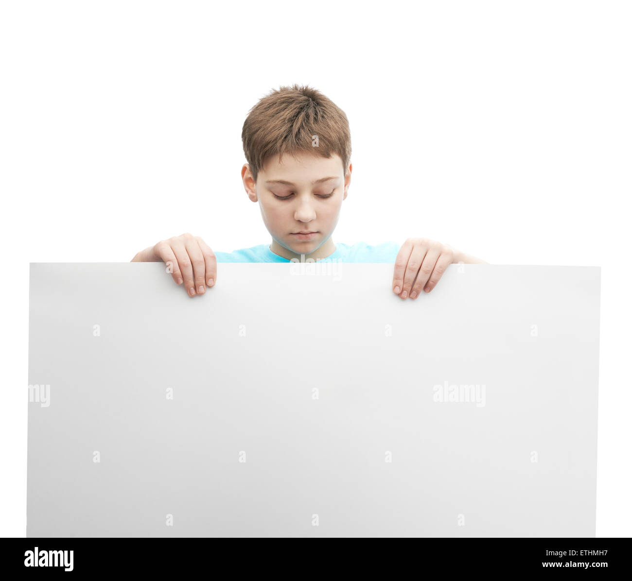Boy Using Paper Young boy with a sheet of paper Stock Photo - Alamy