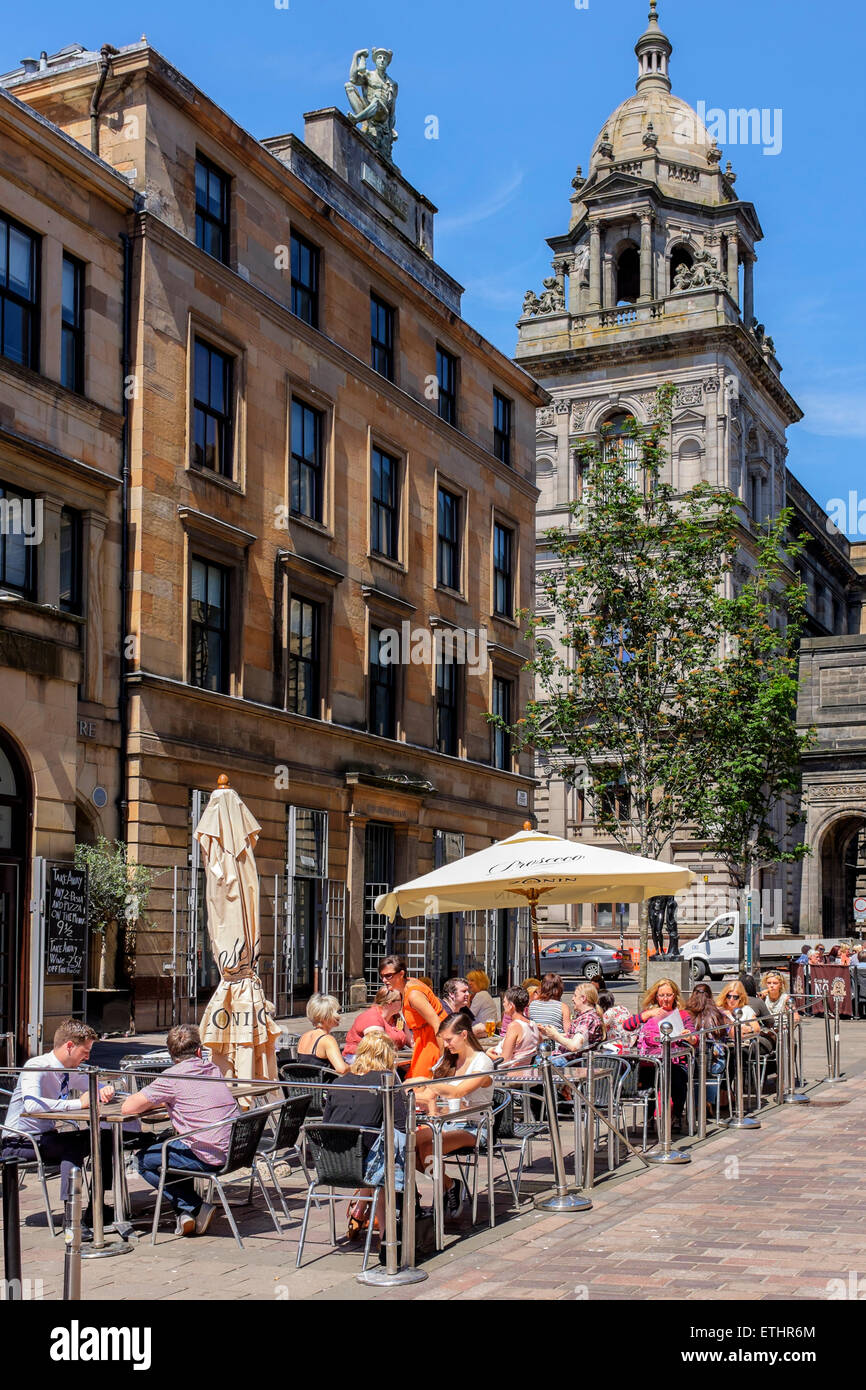 People eating al fresco in the Italian district, John Street of Glasgow with the City Chambers in the background, Glasgow, Stock Photo