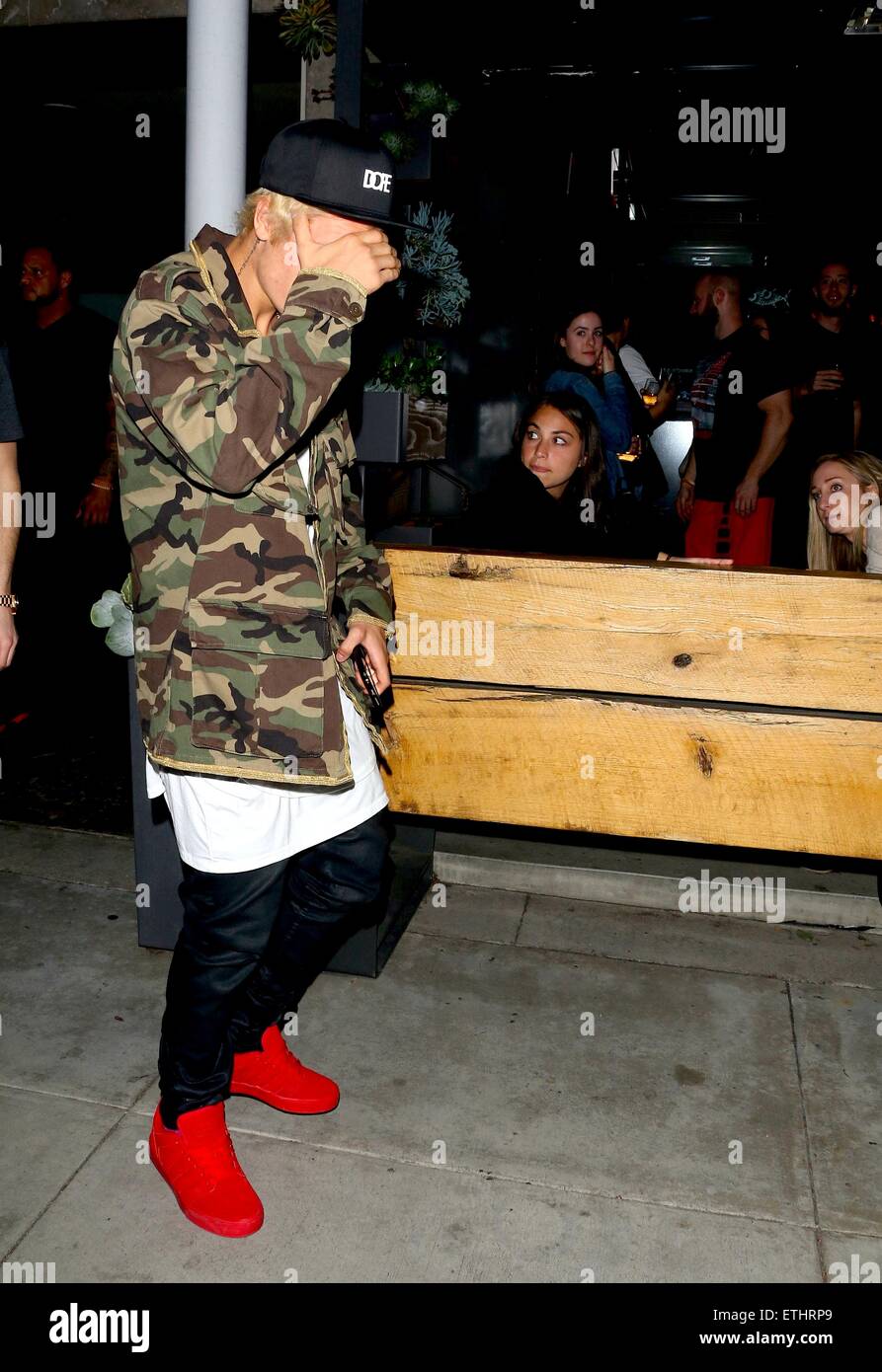 Justin Bieber out and about in Beverly Hills wearing red sneakers, DOPE  baseball cap and a gold braided camouflage jacket Featuring: Justin Bieber  Where: Beverly Hills, California, United States When: 07 Jan