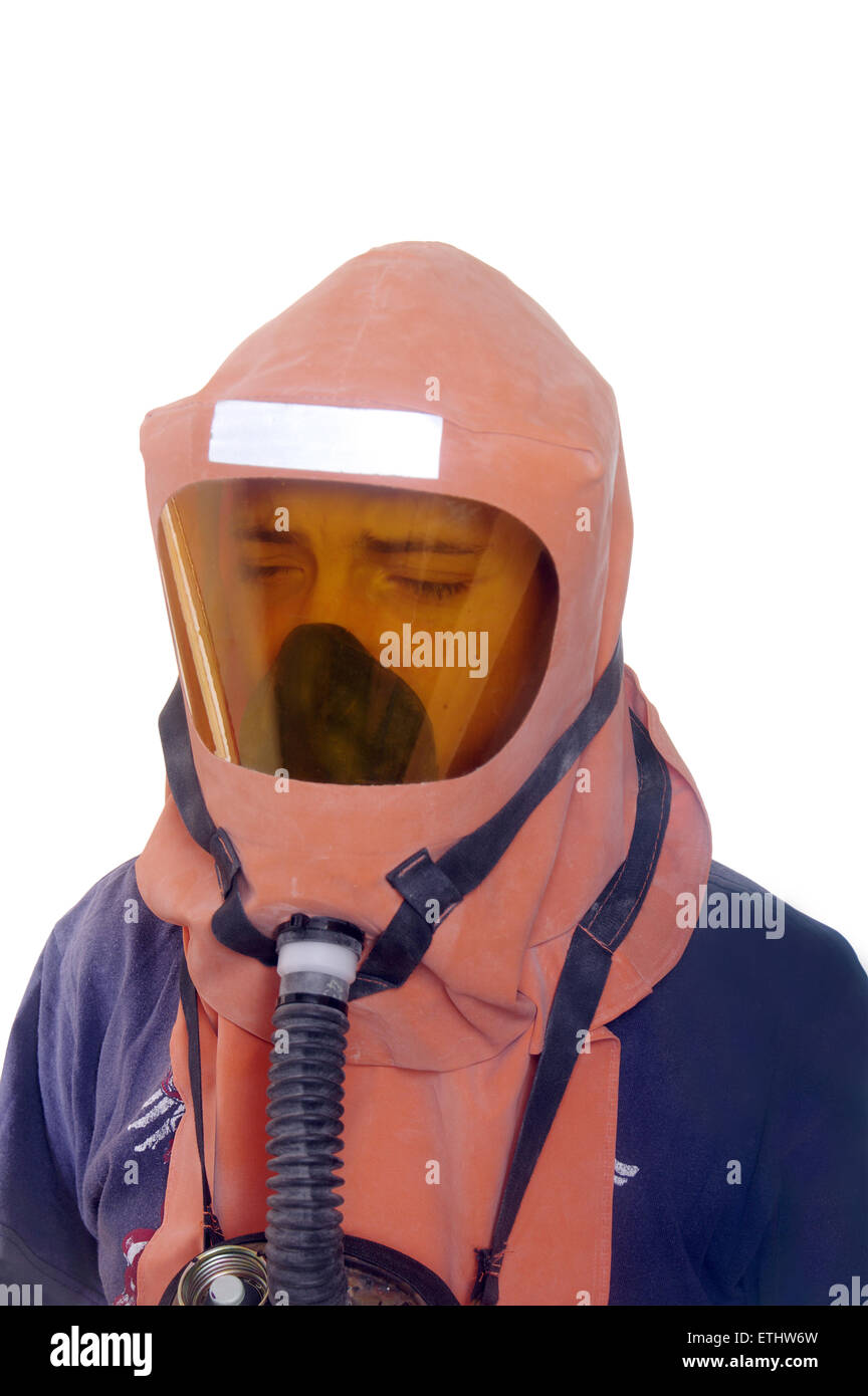 Young boy in a gas mask - self-rescuer is isolated on a white background Stock Photo