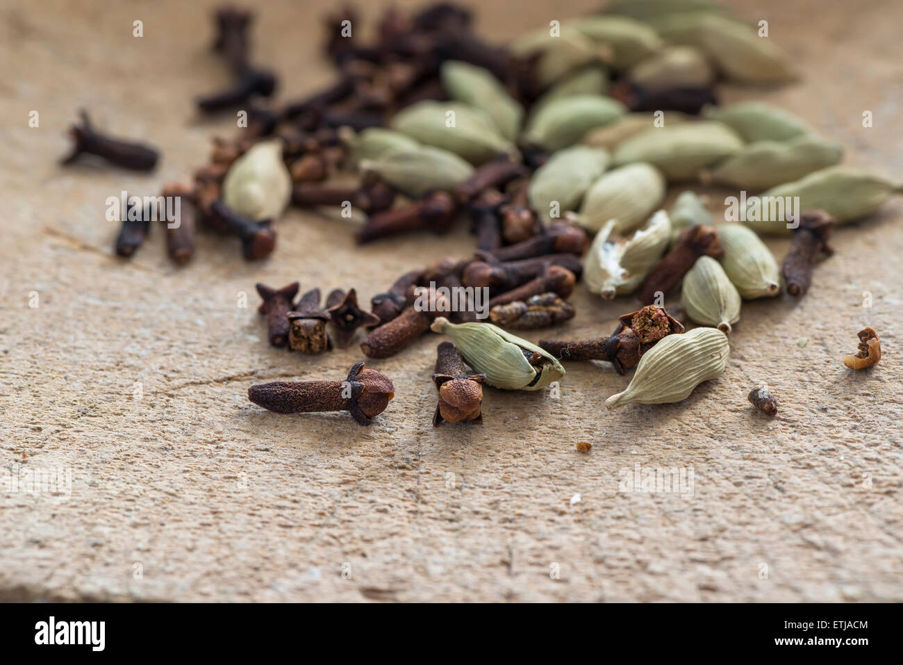 Cardamom pods and cloves closeup with selective focus Stock Photo Alamy