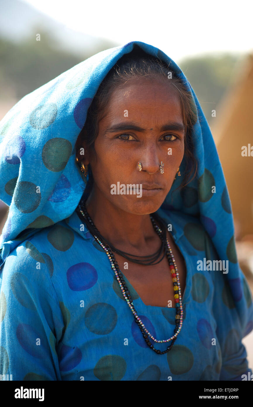Portrait of a Rajasthani woman in blue with distinctive jewellery. Pushkar,  Rajasthan, India Stock Photo - Alamy