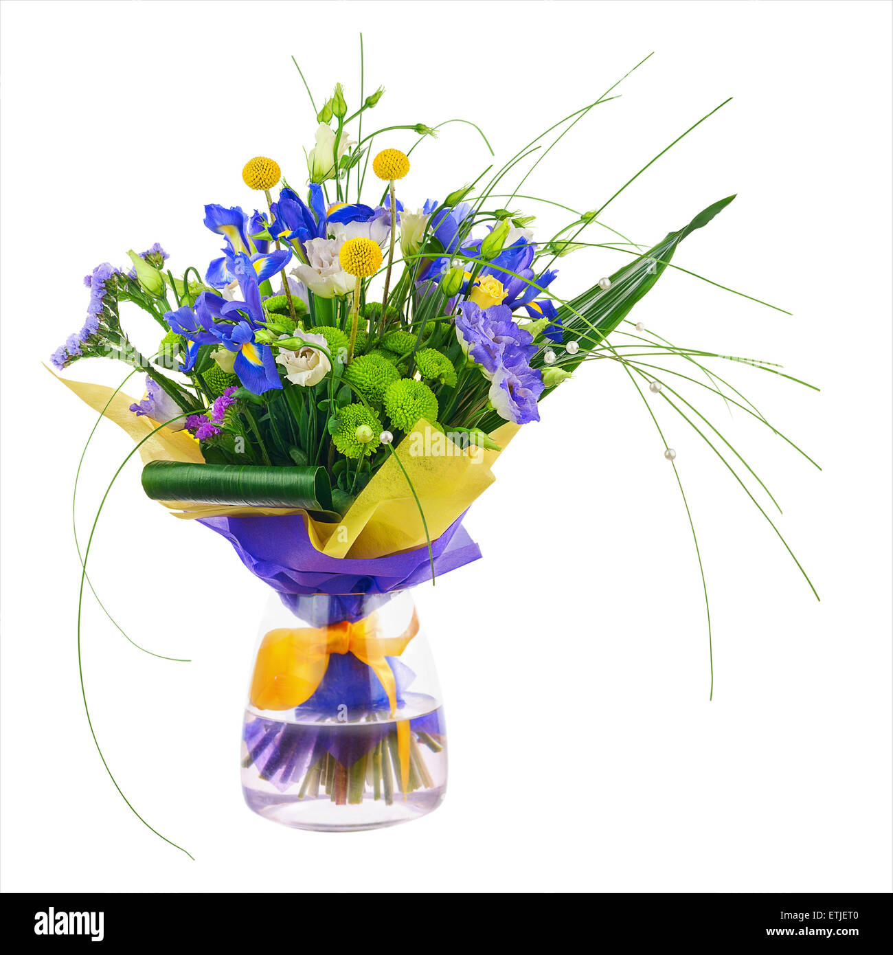 Flower bouquet from roses, green carnation, iris and statice flowers in glass vase isolated on white background. Closeup. Stock Photo