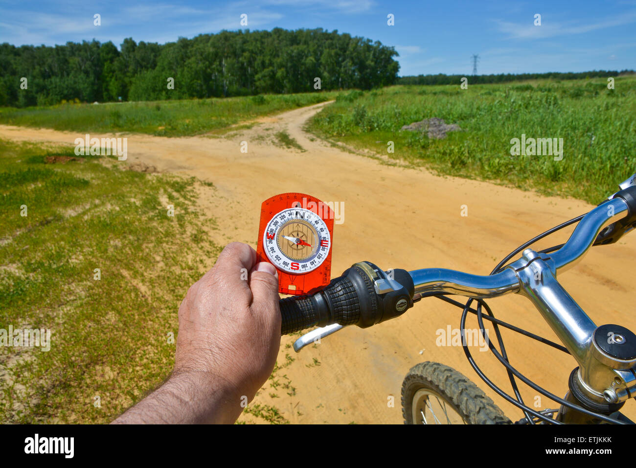 With a compass and a Bicycle front fork. Orientation during a bike ride