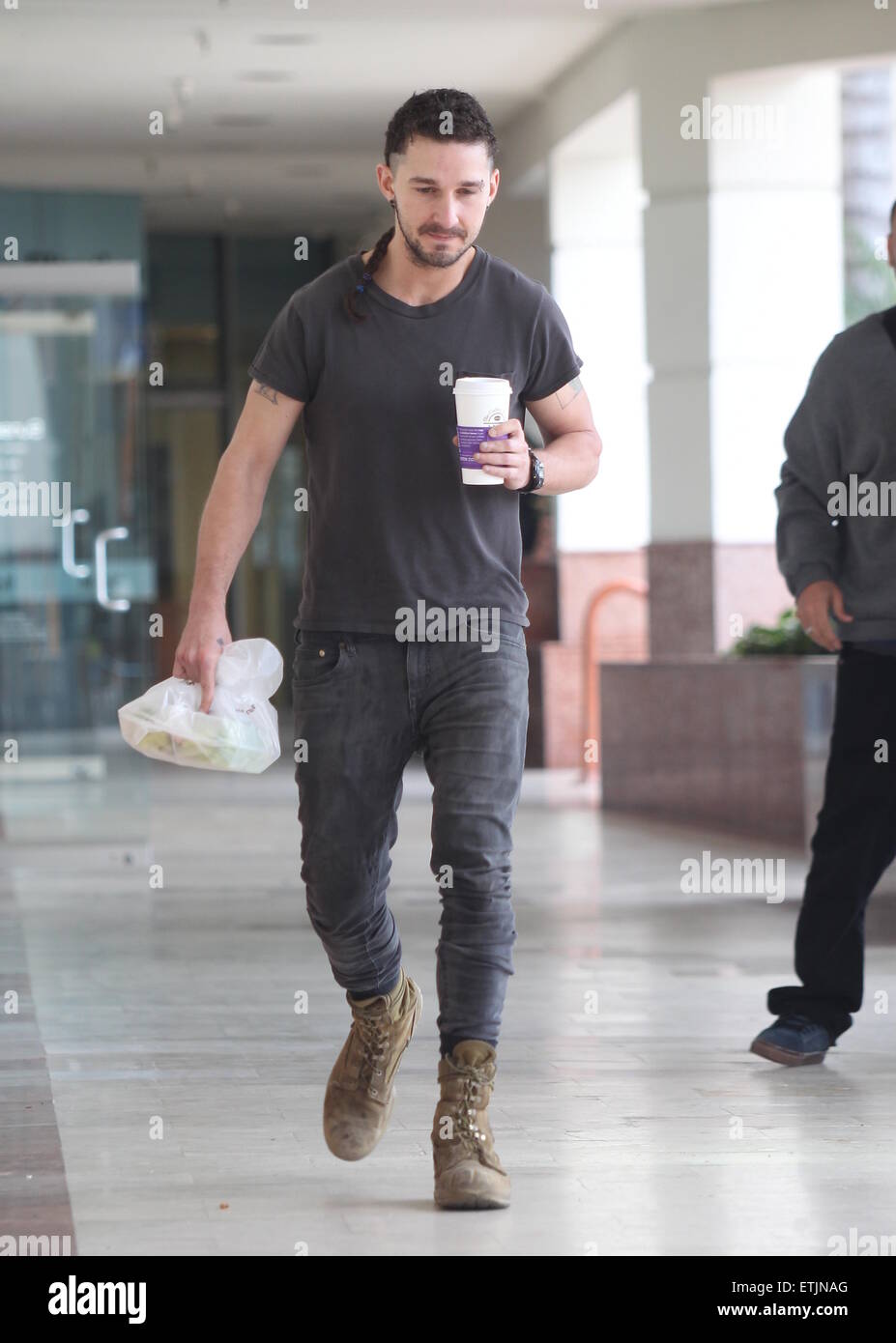 Shia LaBeouf, sporting a new rattail style haircut, grabs ...