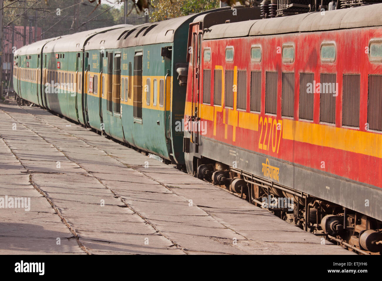 Train carriages displaying the distinctive livery of the Northern division of Indian railways in New Delhi Stock Photo