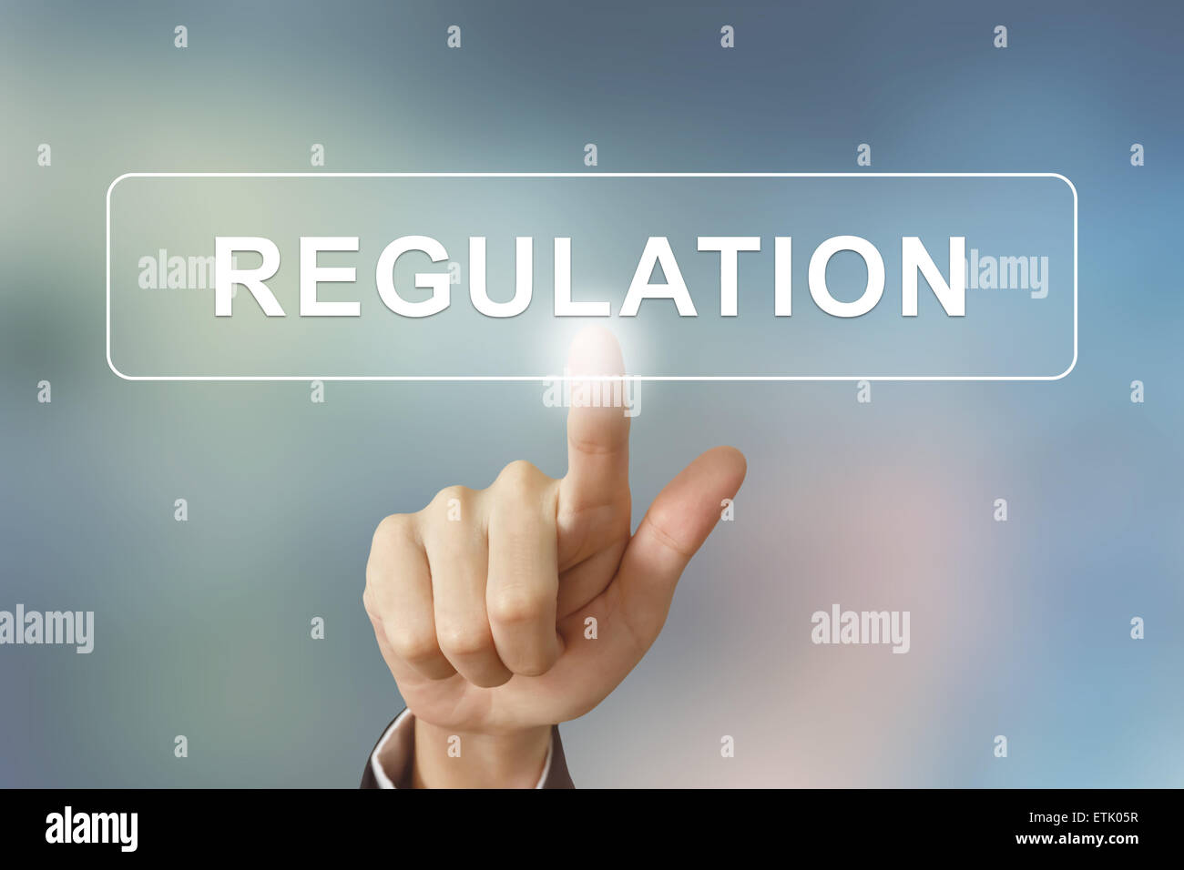 business hand pushing regulation button on blurred background Stock ...
