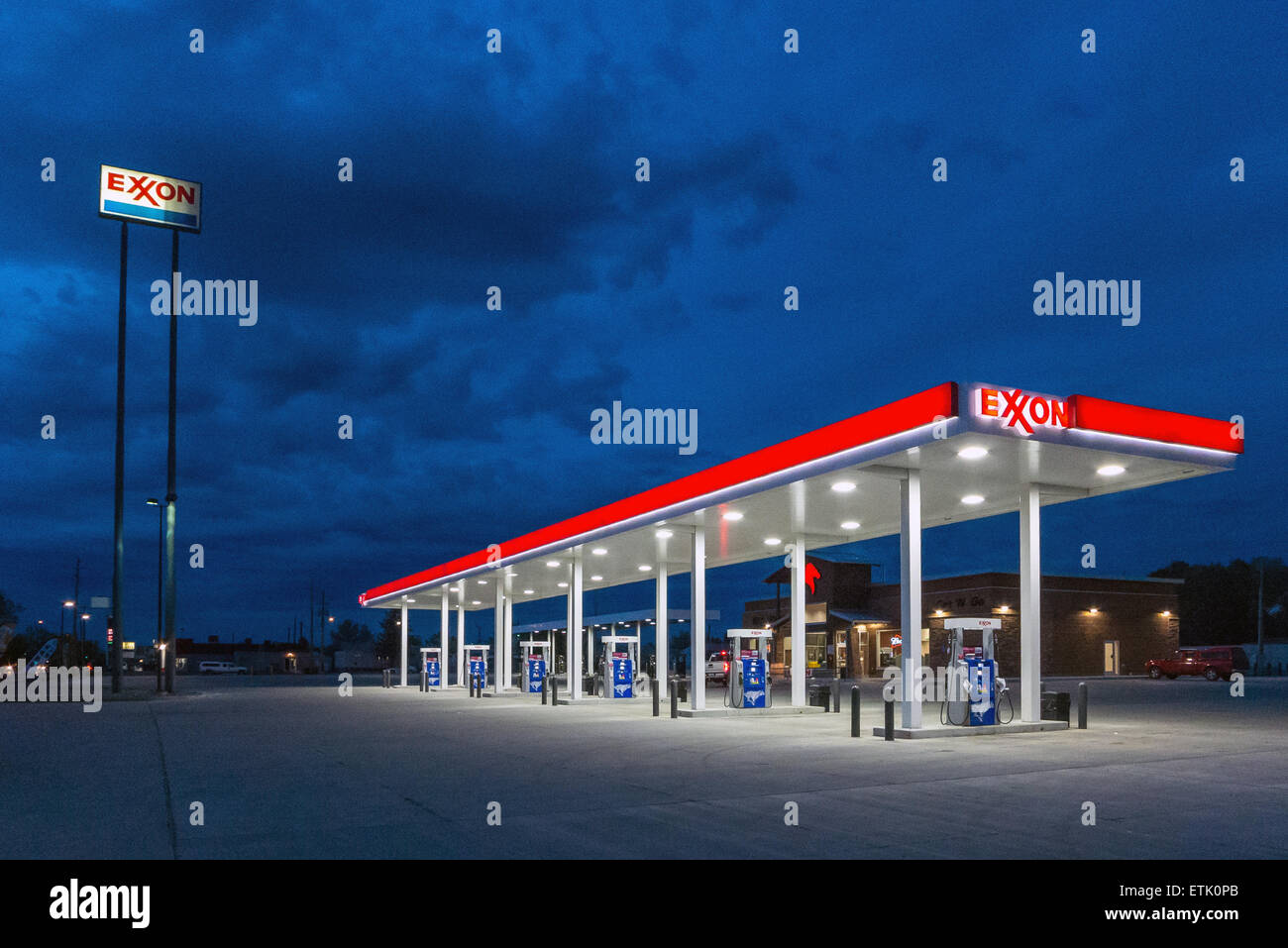 Deserted Exxon gasoline station by night in Rock Springs Wyoming Stock