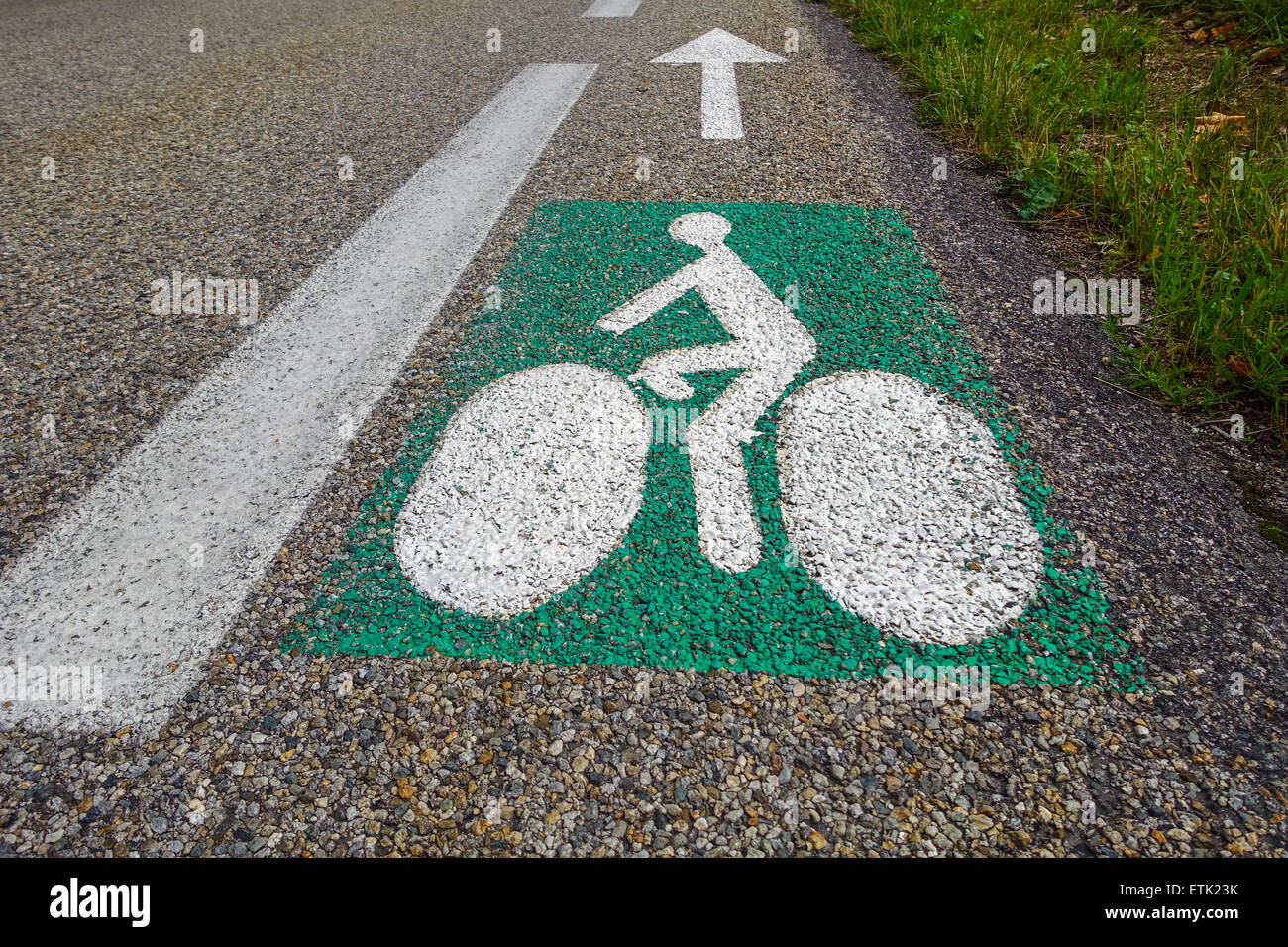 Green and white sign painted on road on cycleway, cycle way cyclelane