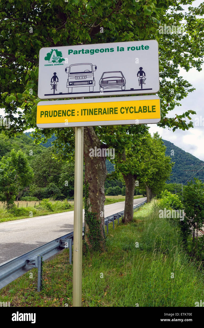 A French road sign asking motorists to take care with cyclists, along a cycle route near Tarascon sur Ariege, France Stock Photo