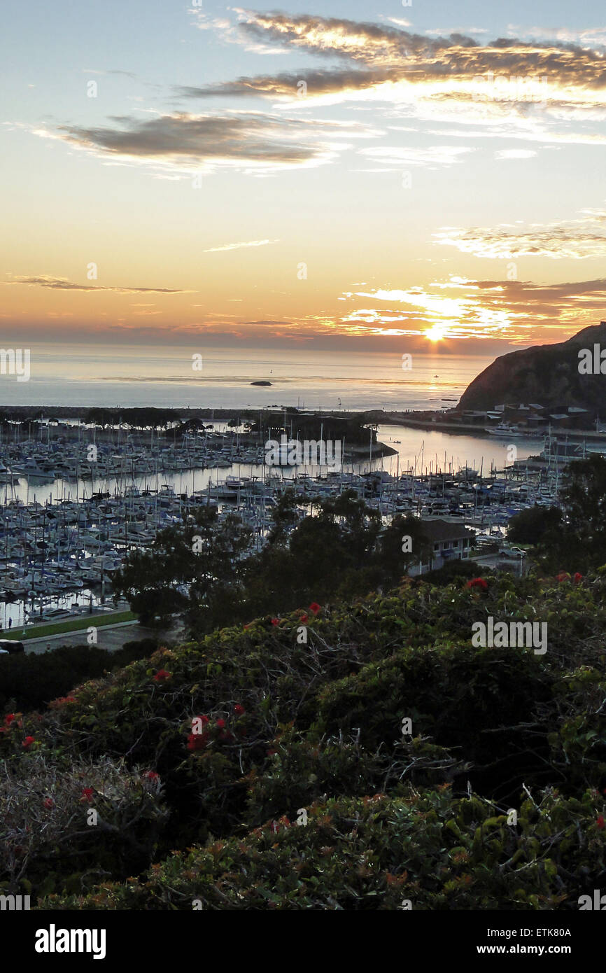 Dana Point harbor view of the sunset and a private beach below Stock Photo