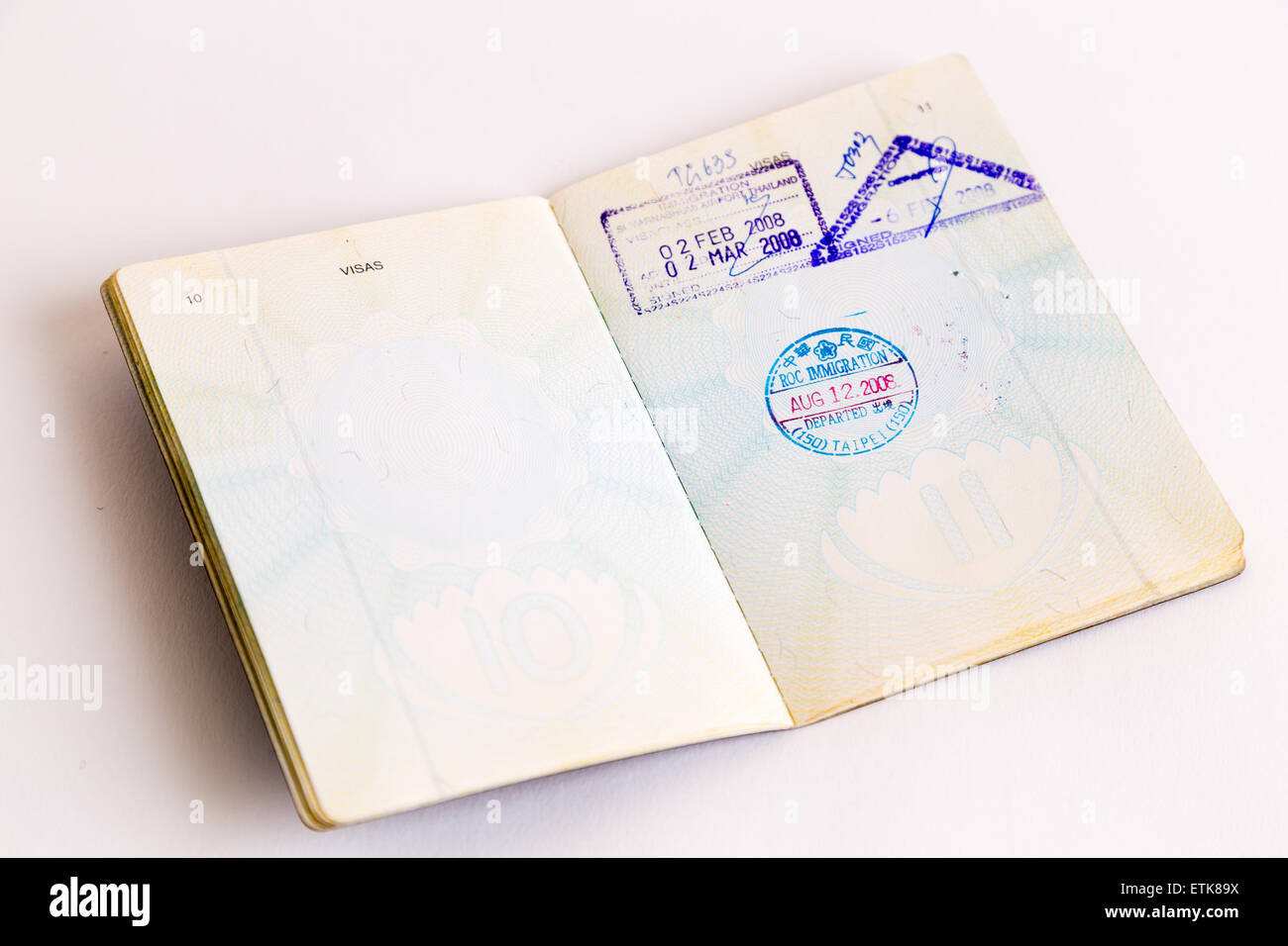 Visa and customs stamps in passports Stock Photo Alamy