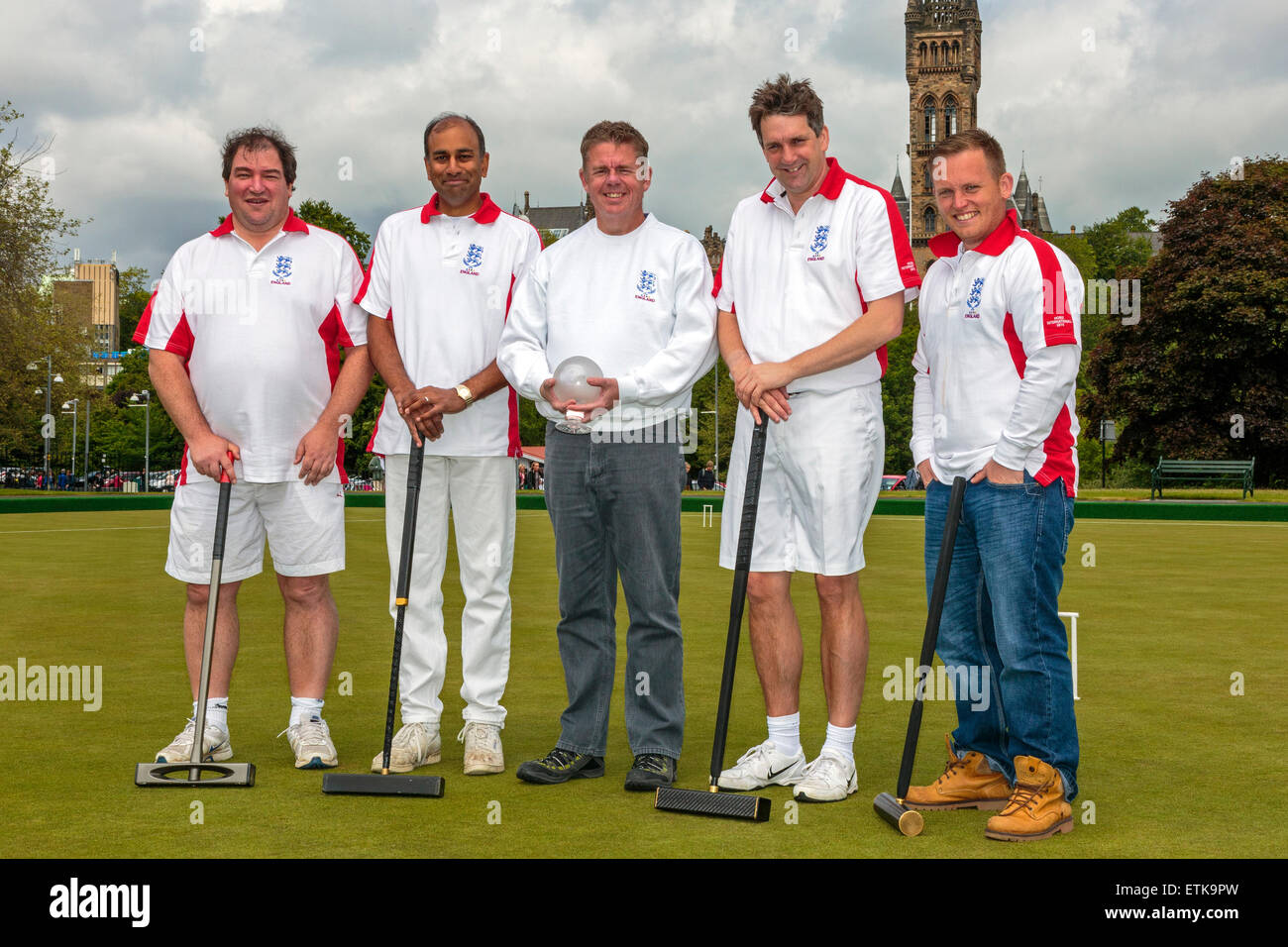 Glasgow, Scotland, UK. 14th June, 2015. On Saturday 13 June and Sunday 14 June Glasgow hosted the annual Four Nations Croquet Tournament at Kelvingrove Park and organised by the Scottish Croquet Association. Players from Scotland, Ireland, England and Wales each played 5 'rubbers' against the opposing teams. This year the winning team was  ENGLAND. Picture is of the winning England team Credit:  Findlay/Alamy Live News Stock Photo