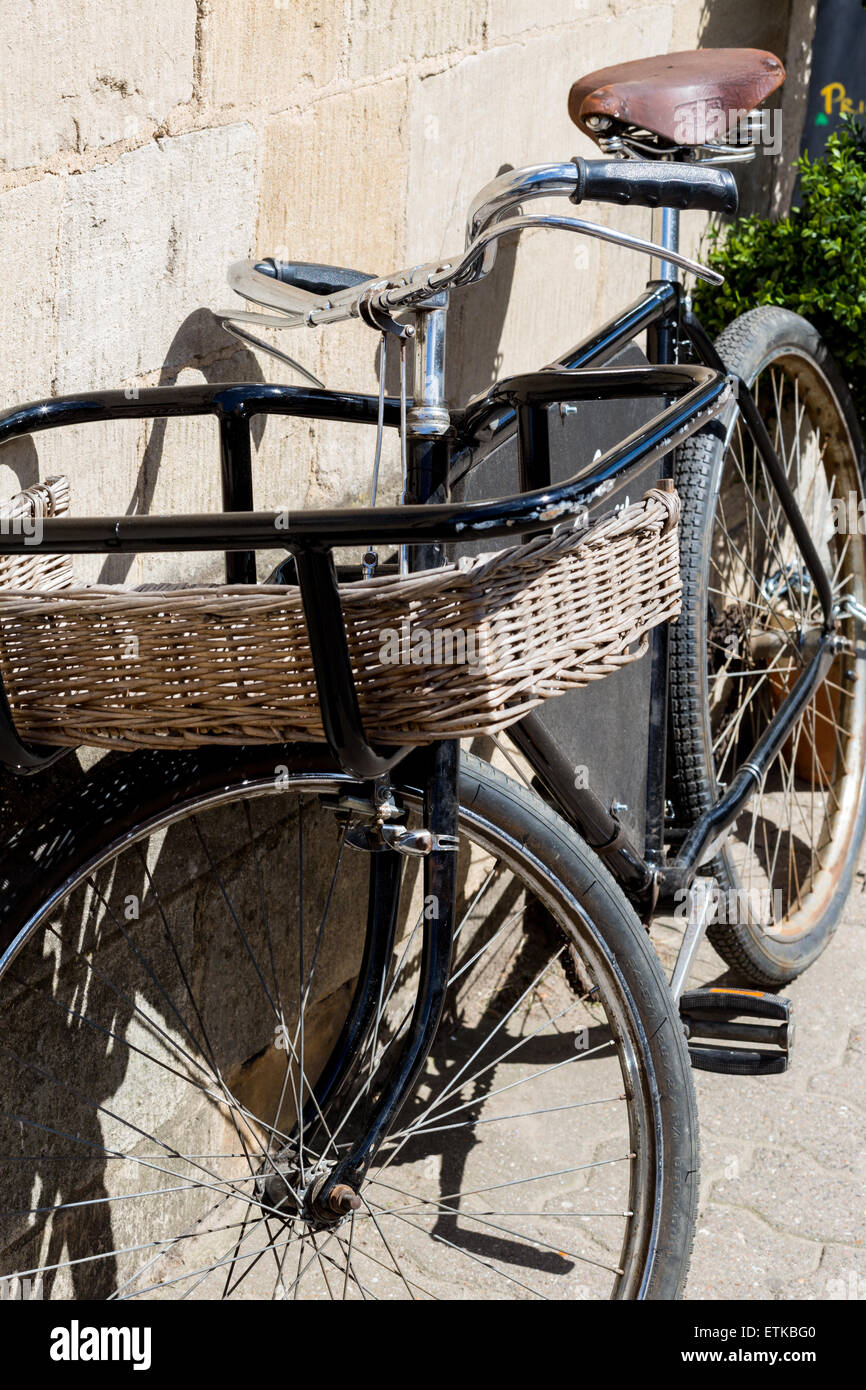 Traditional old bike with basket in the Cotswolds Stock Photo