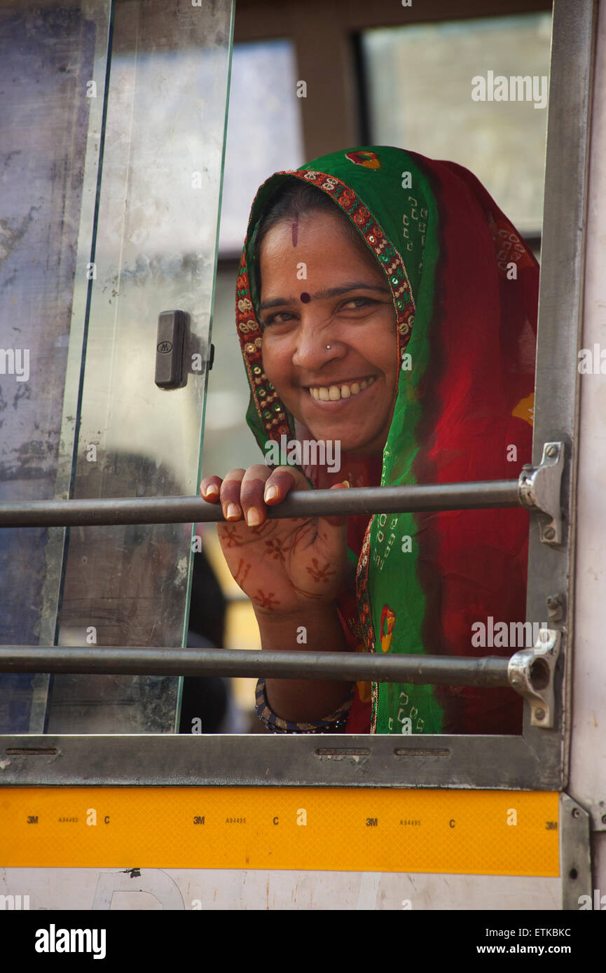 Friendly Indian woman in a sari on a bus. Jaipur, Rajasthan, India Stock Photo