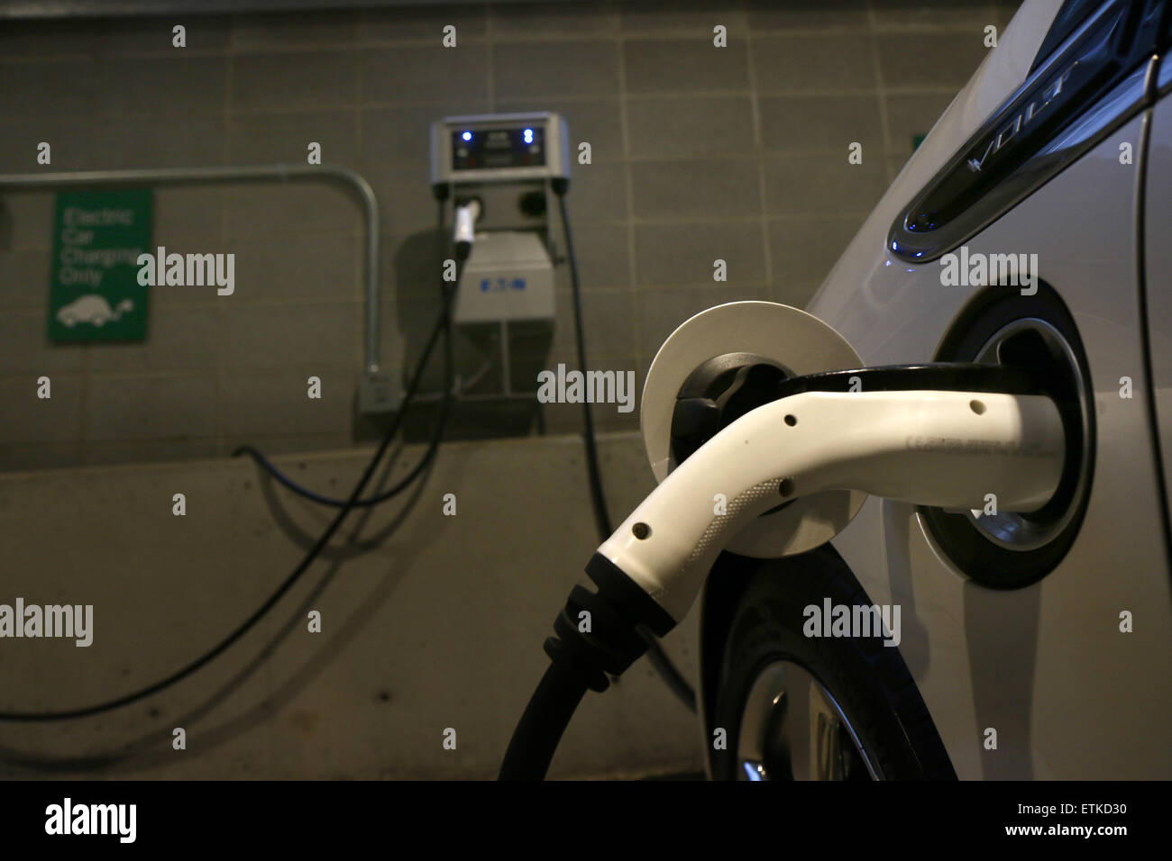 Electric car parking space charging station Cincinnati Ohio Stock Photo