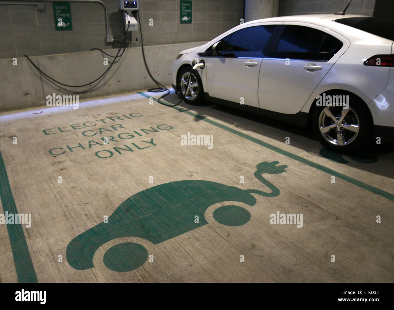 Electric car parking space charging station Cincinnati Ohio Stock Photo