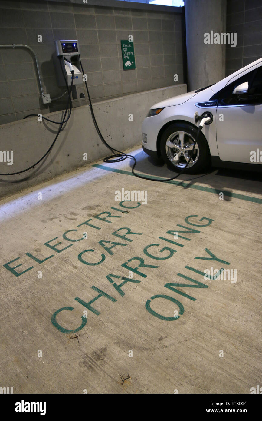 Electric car parking space charging station Cincinnati Ohio Stock Photo