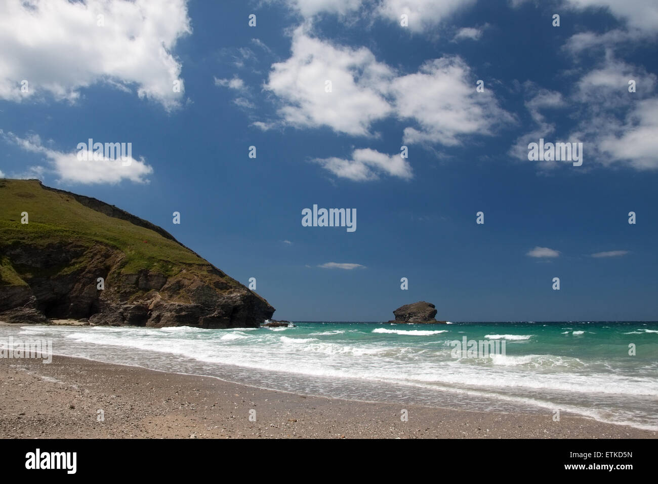 Portreath beach in Cornwall with Western Hill headland and Gull Rock out to sea Stock Photo