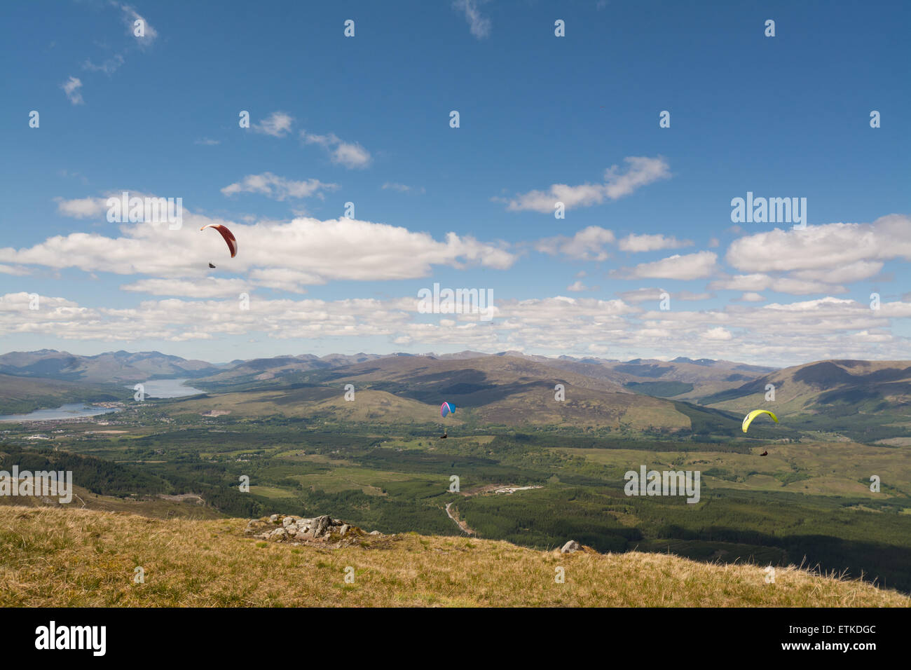 Aonach Mor, Fort William, Scotland, UK: 14 June 2015. UK weather.   Paragliders from the peak of Sgurr Finnisg-aig, near the top of the Nevis Range Gondola enjoying a beautiful sunny day in the Scottish Highlands Credit:  Kay Roxby/Alamy Live News Stock Photo
