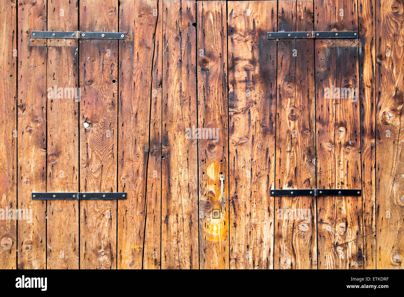 Old wooden barn antique door textured background Stock Photo