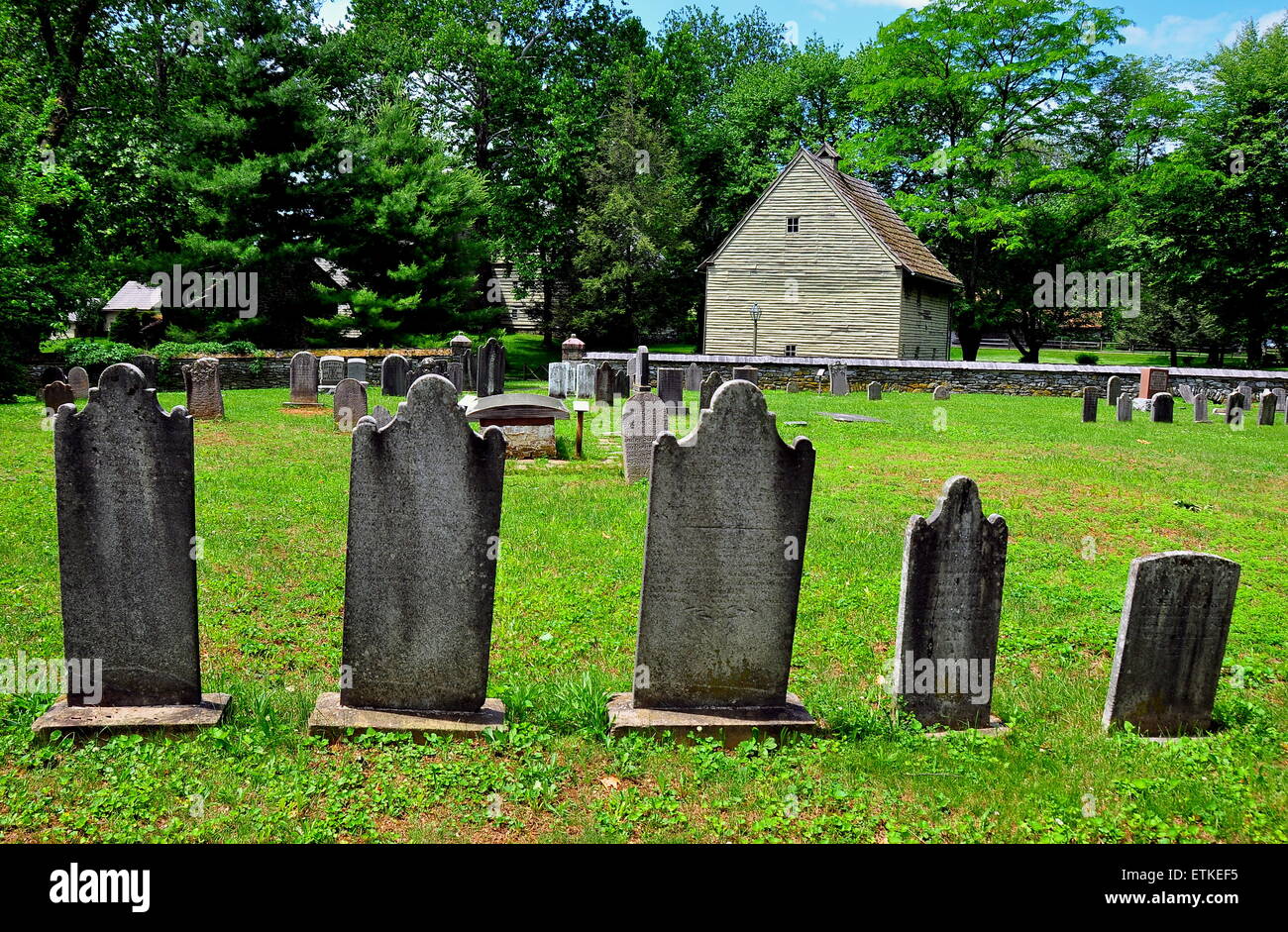 Ephrata, Pennsylvania:   Gravestones in God's Acre Burial Ground and Weaver's House at 18th century Ephrata Cloister * Stock Photo