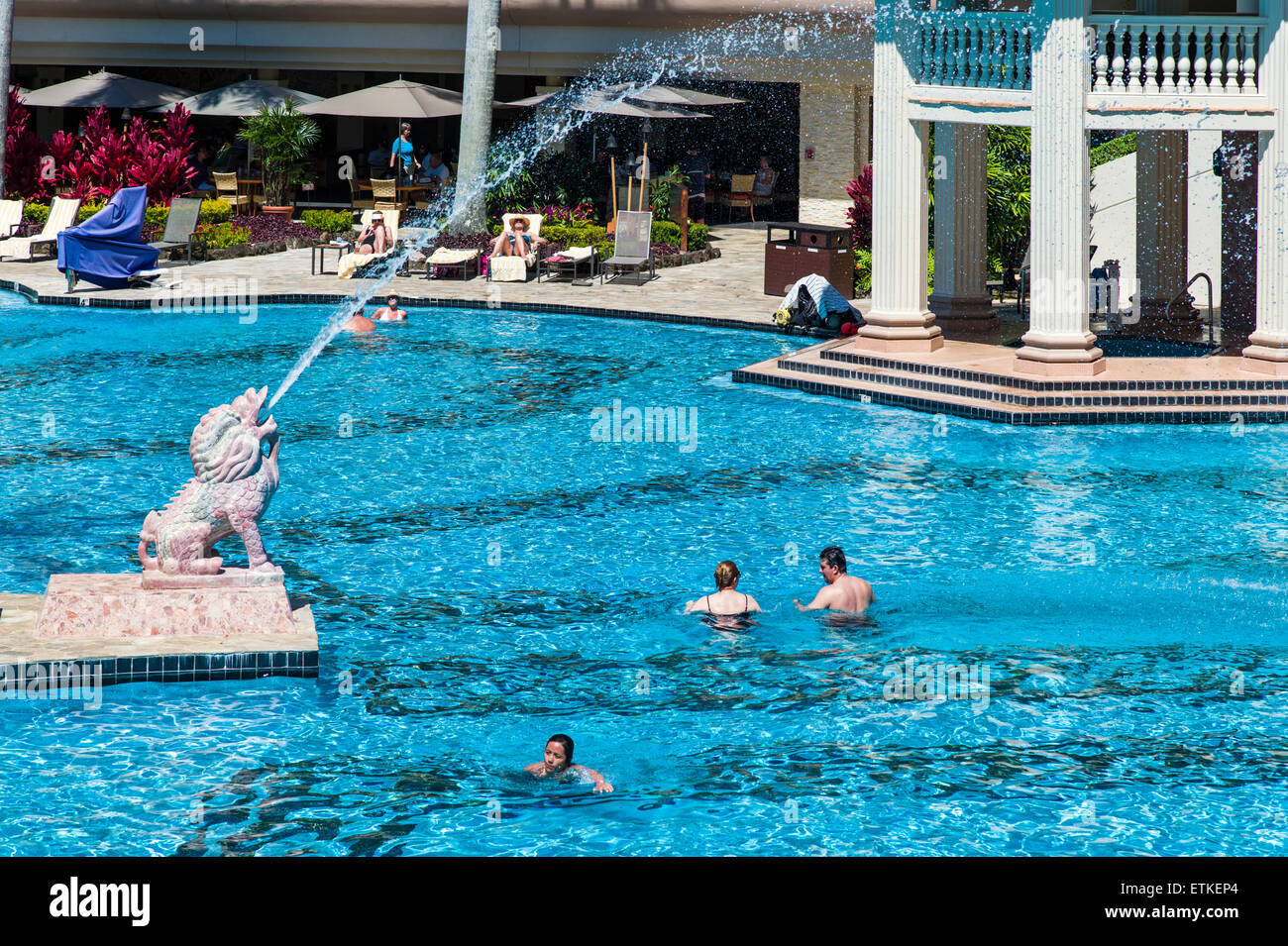 Guests enjoy the 26,000 sq. ft. swimming pool, Kaua’i Marriott Resort; Kalapaki Bay, Kaua'i, Hawaii, USA Stock Photo
