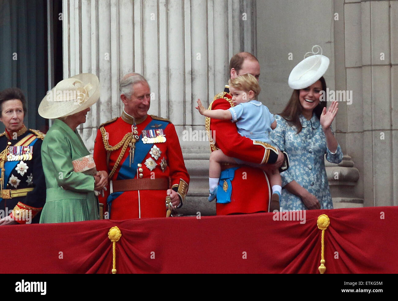 Trooping the Colour . . London, UK . . 13.06.2015 Prince George and Kate (Catherine Middleton) Duchess of Cambridge, wave to the crowd as his father Prince William, Duke of Cambridge, takes him back inside at the Trooping of the Colour 2015. His Grandfather Prince Charles, Prince of Wales, and Camilla, Duchess of Cornwall, look on admiringly. Pic: Paul Marriott Photography Stock Photo