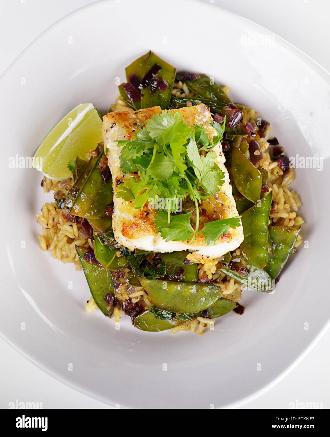 Cod Fish Fillets With Rice and Peas Stock Photo