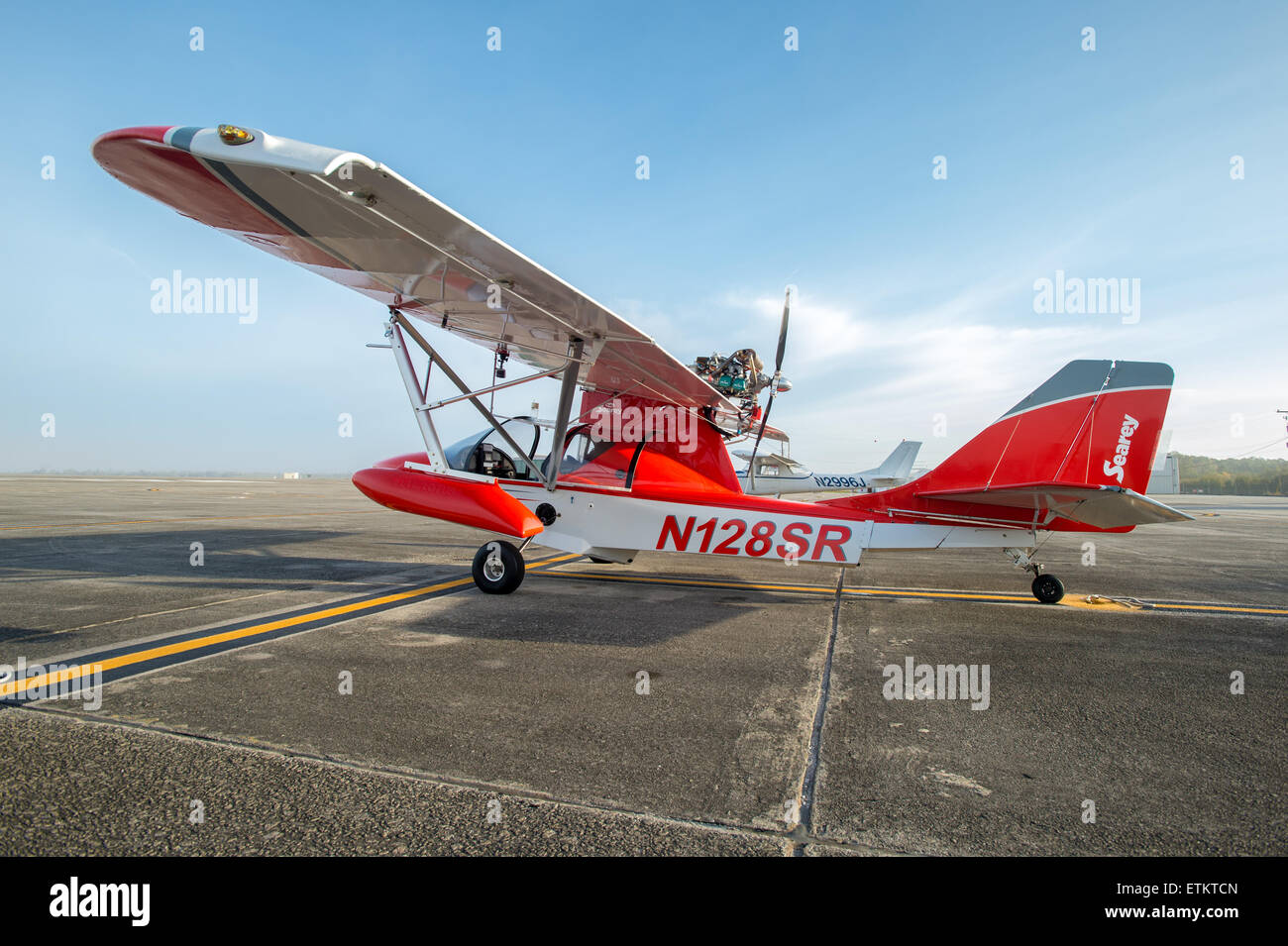 The side view of a Searey seaplane sitting on the runway  USA Stock Photo