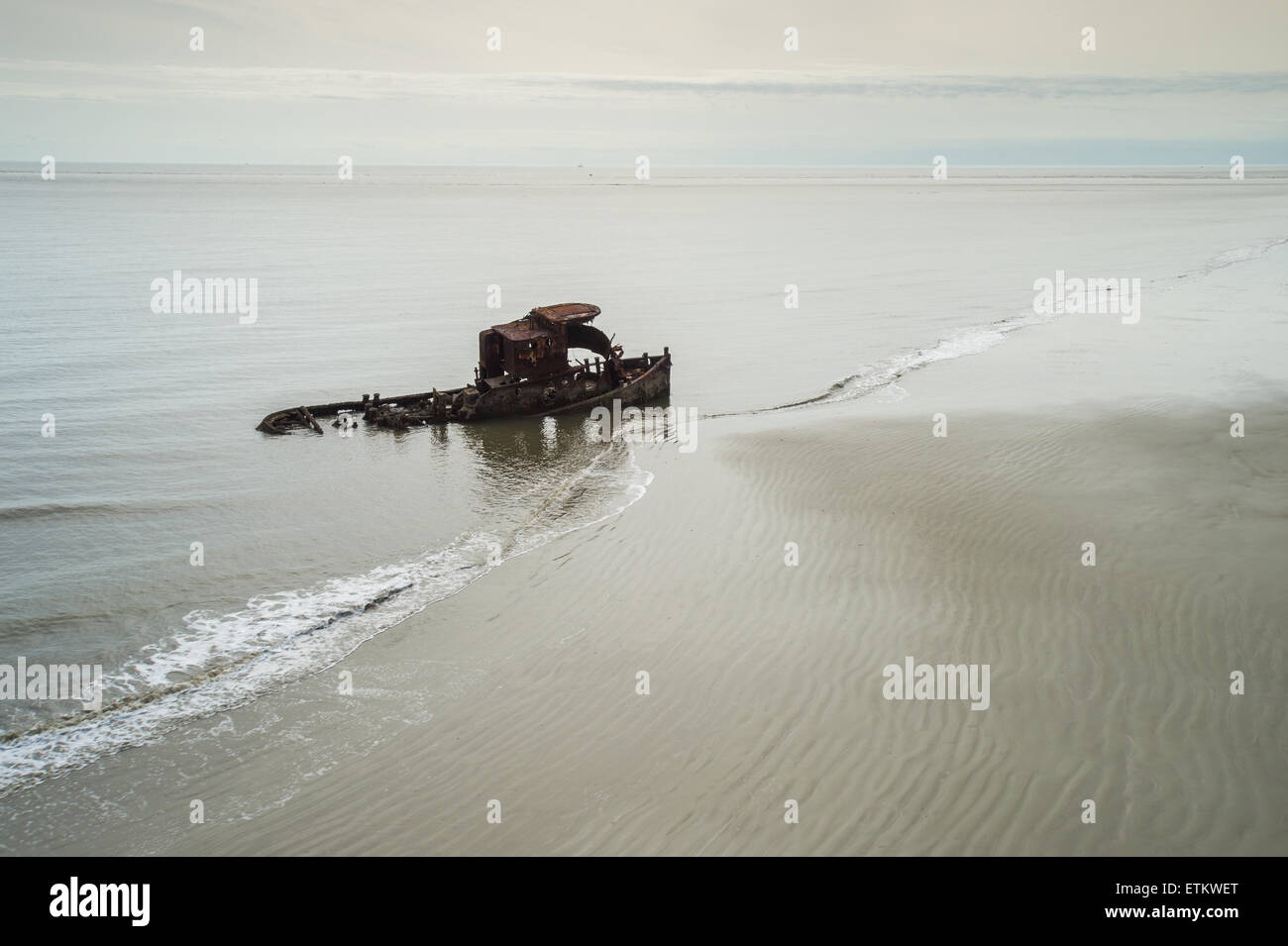 Rusty wreckage of old ship in beach water in Southeastern USA Stock Photo