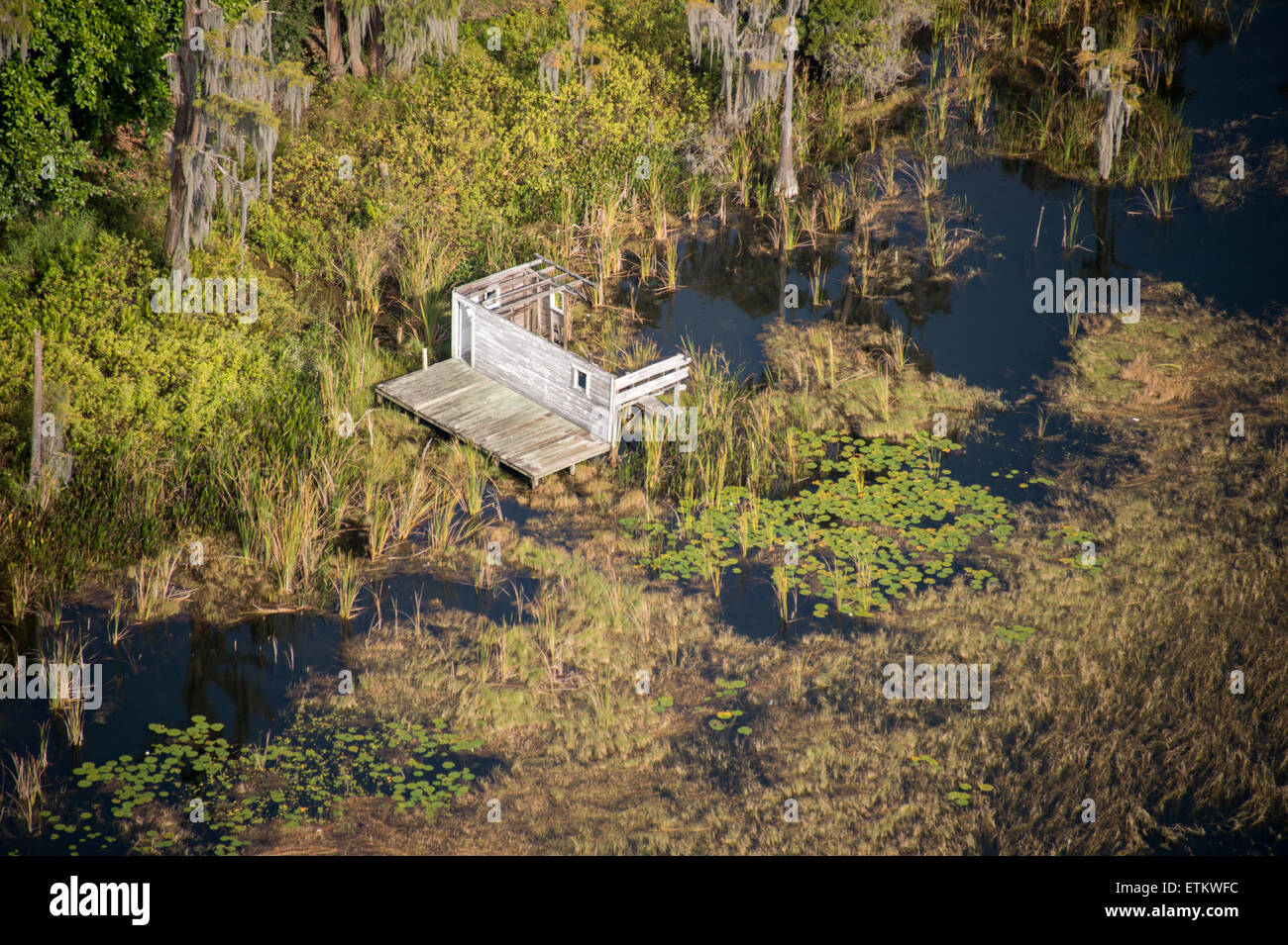 Aerial of the remains of a destroyed house in marshland in Southeastern USA Stock Photo