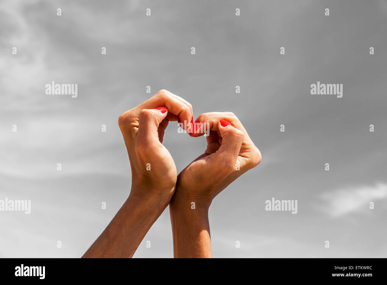 Retro Photo Of Girl Hands In Heart Shape On Blue Sky Stock Photo - Alamy