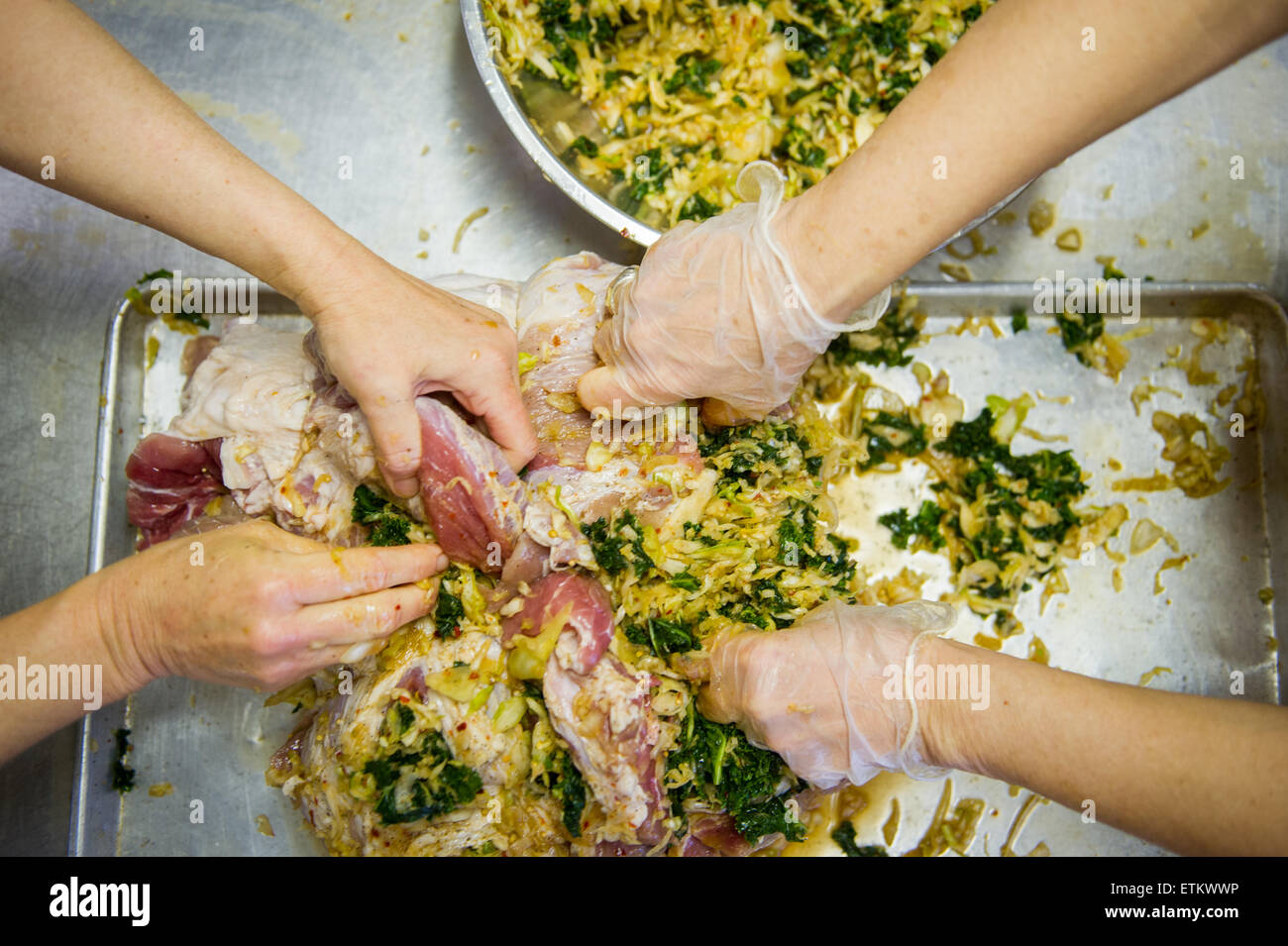 People stuffing hams in St Mary's County Maryland, USA Stock Photo Alamy