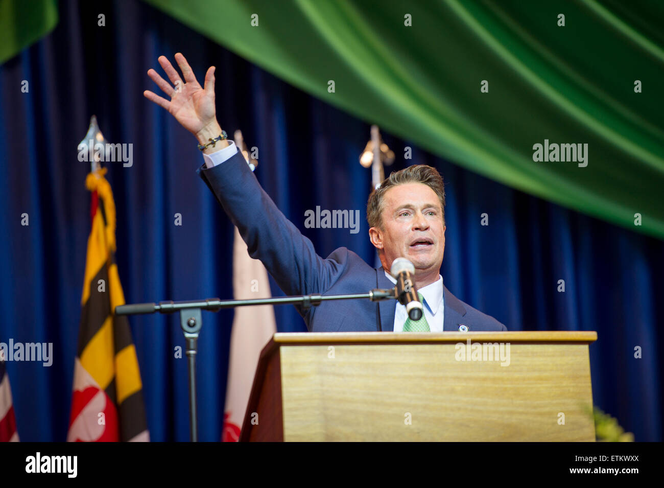 Barry Glassman, county executive at the podium waving to the crowd at his 2014 Harford County inauguration at Harford Community Stock Photo