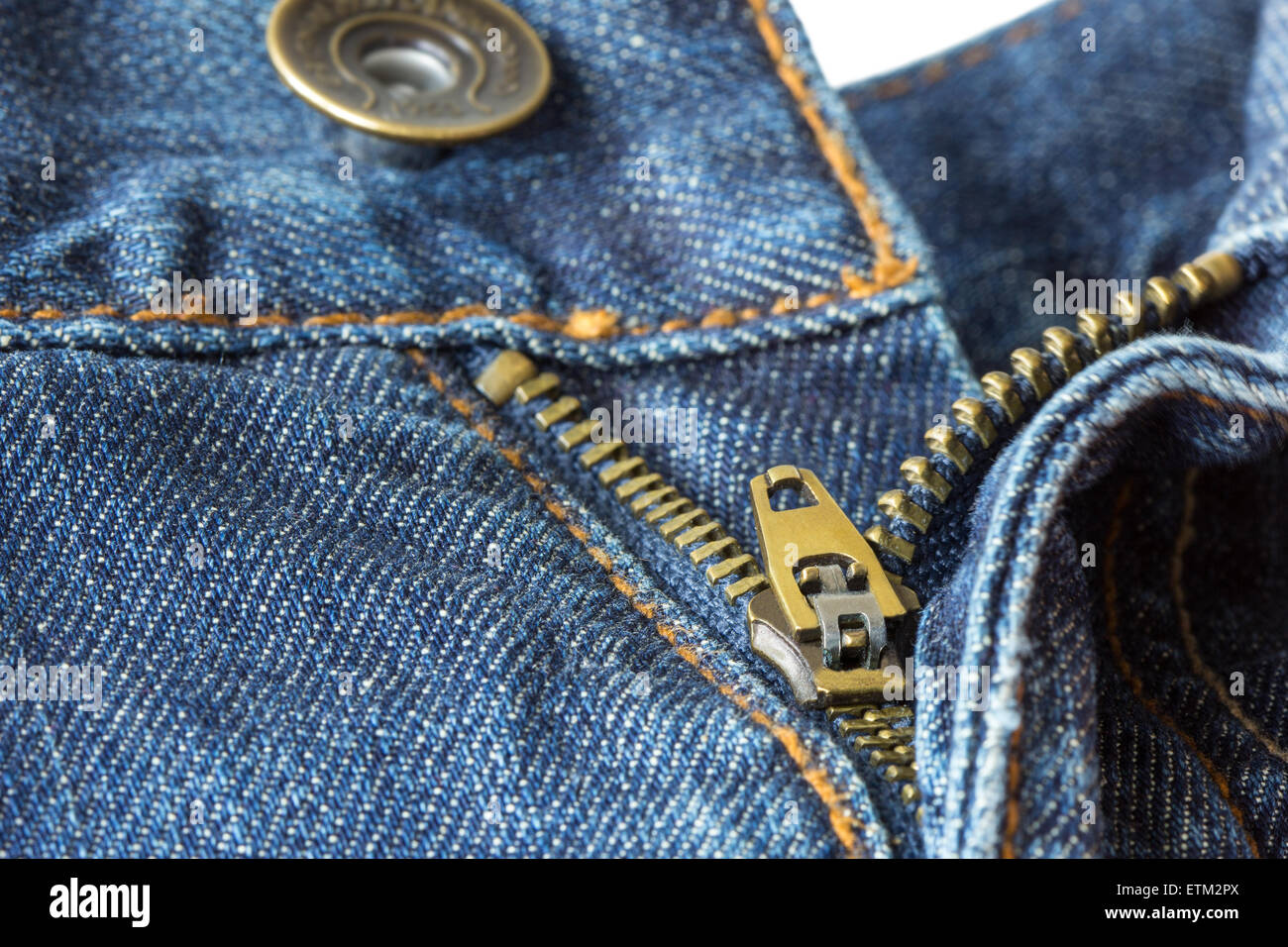 Close-up of open, unzipped and unbuttoned blue denim jeans isolated on white background Stock Photo