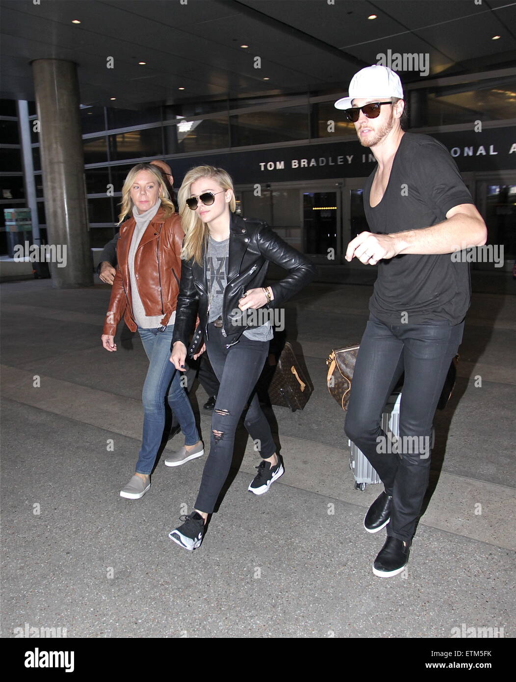 Chloe Grace Moretz with her brother and mother arrive at Los Angeles