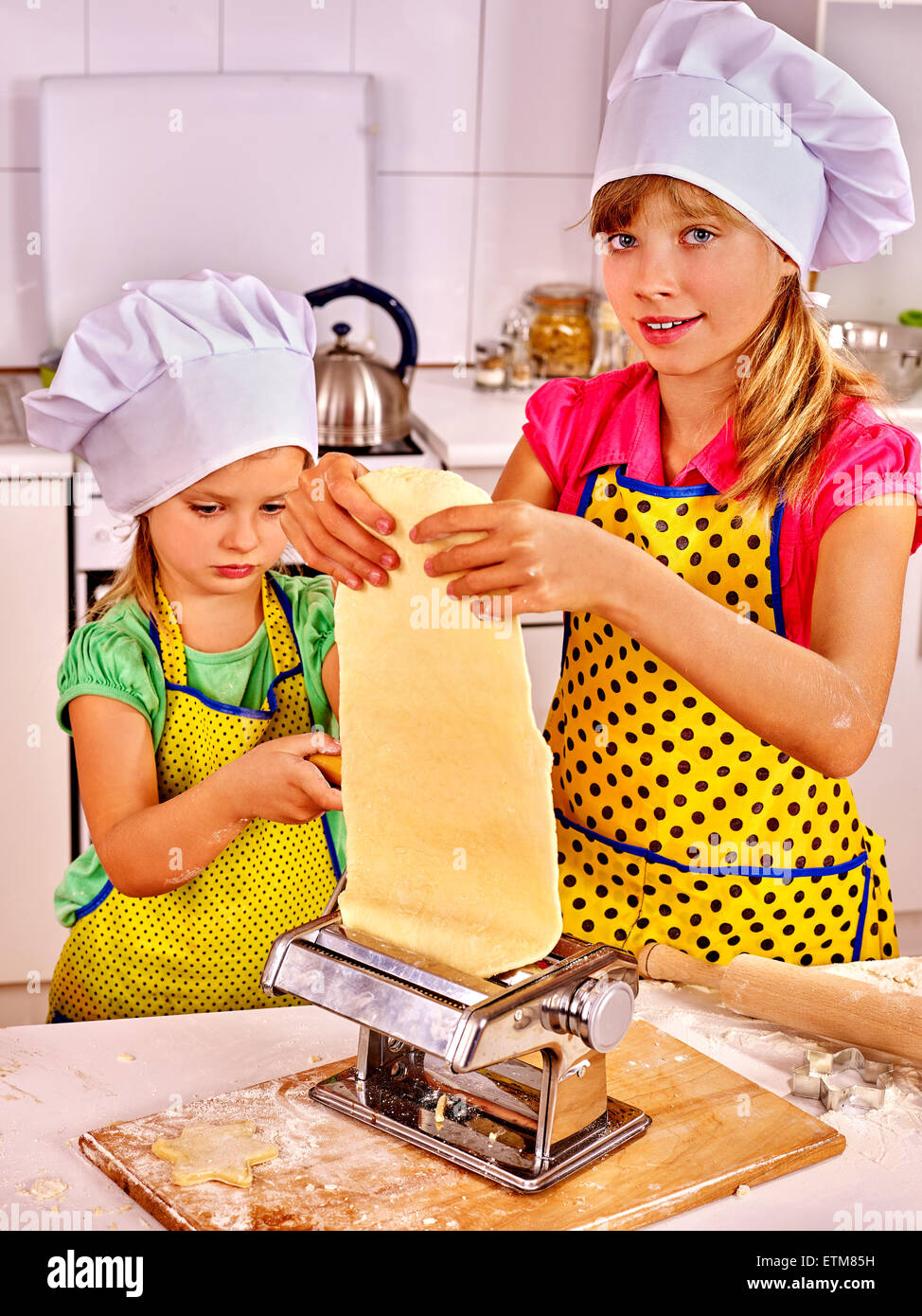 Kids girl making homemade pasta at kitchen Stock Photo - Alamy