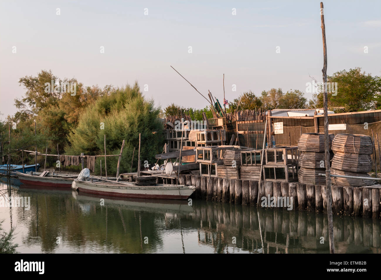 Venice, Italy. Fishermen's shacks, boats and crab or eel traps on one of the many tiny islands in the Venetian lagoon Stock Photo