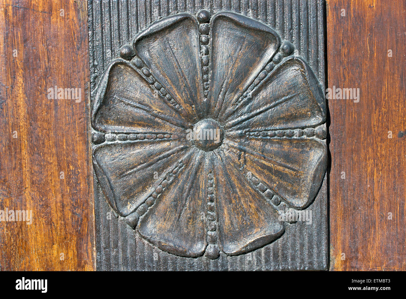 Carved iron relief flower as a garnish on the door Stock Photo