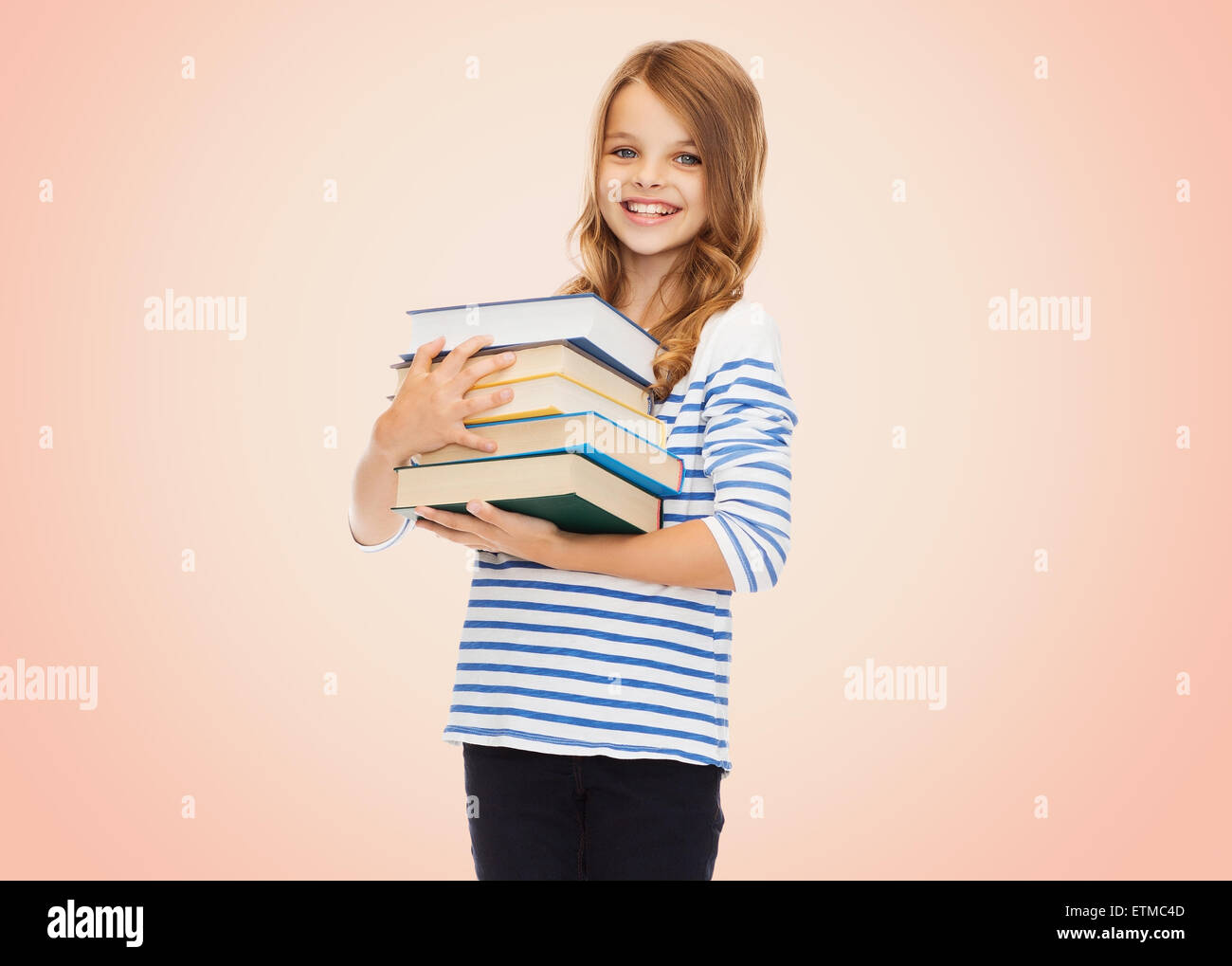 happy little student girl with many books Stock Photo - Alamy