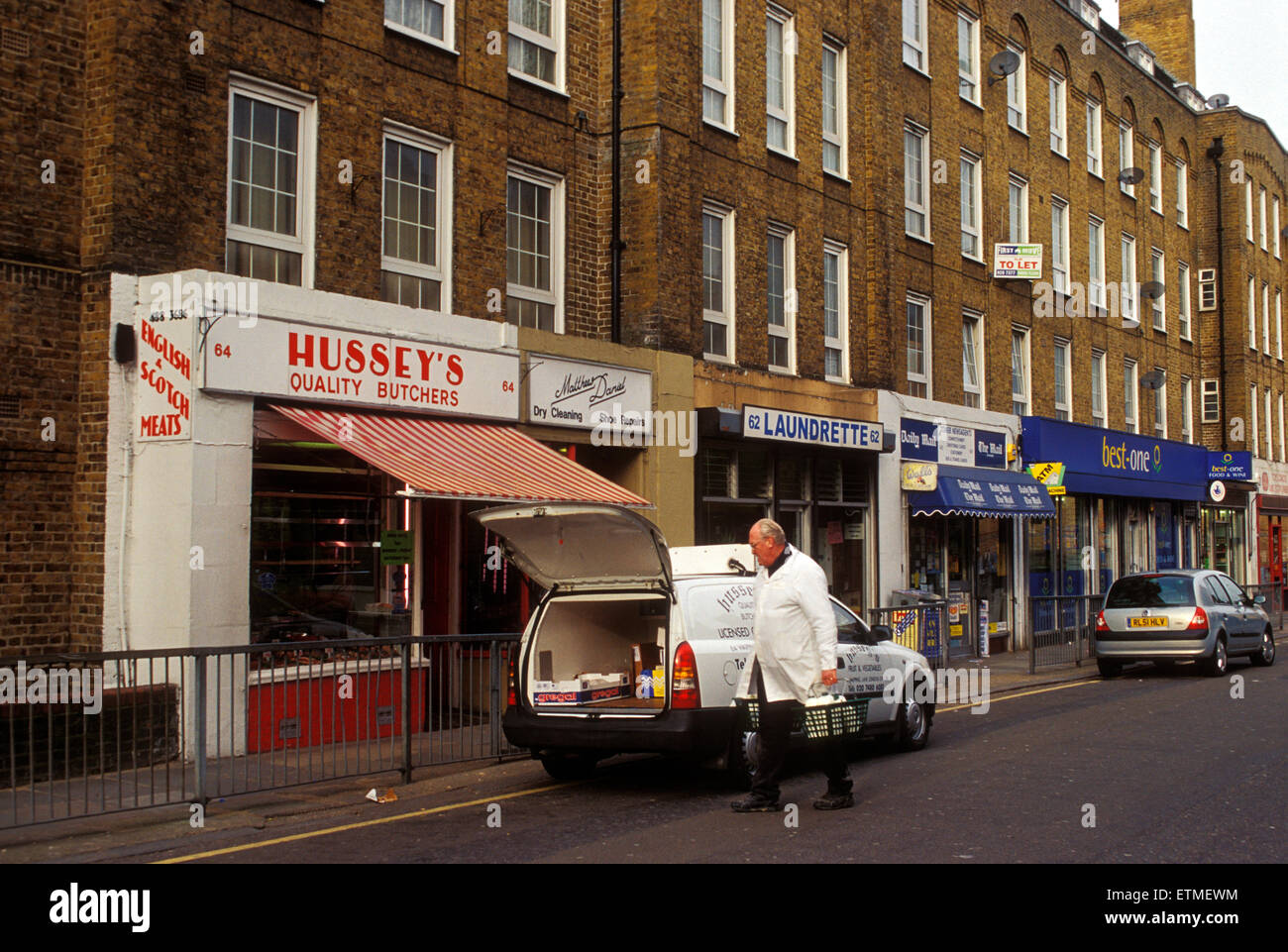 Wapping, London, England.  The shopping strip in Wapping Lane caters to a mix of  upwardly mobile and public housing residents Stock Photo
