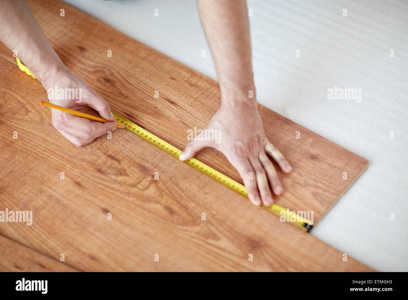 Man Making Laminate Flooring Installation Stock Photos Close Up Of Male Hands Measuring Flooring Stock Image
