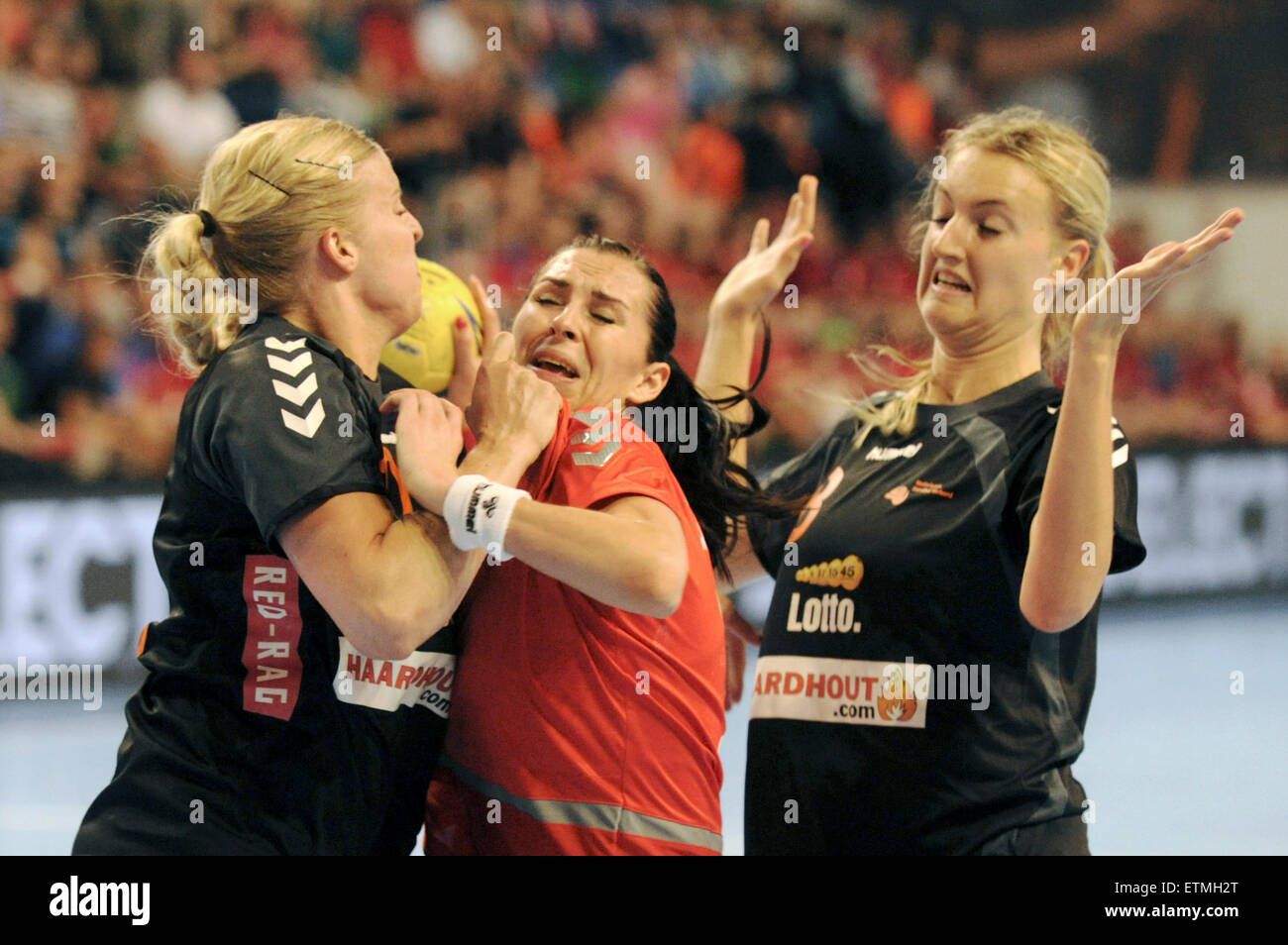 Iveta Luzumova of Czech Republic, center, Danick Snelder, left, and Kelly Dulfer, right, of Netherlands in action during the return match of qualifier of women's handball world cup Czech Republic vs Netherlands in Most, Czech Republic, June 13, 2015. (CTK Photo/Libor Zavoral) Stock Photo