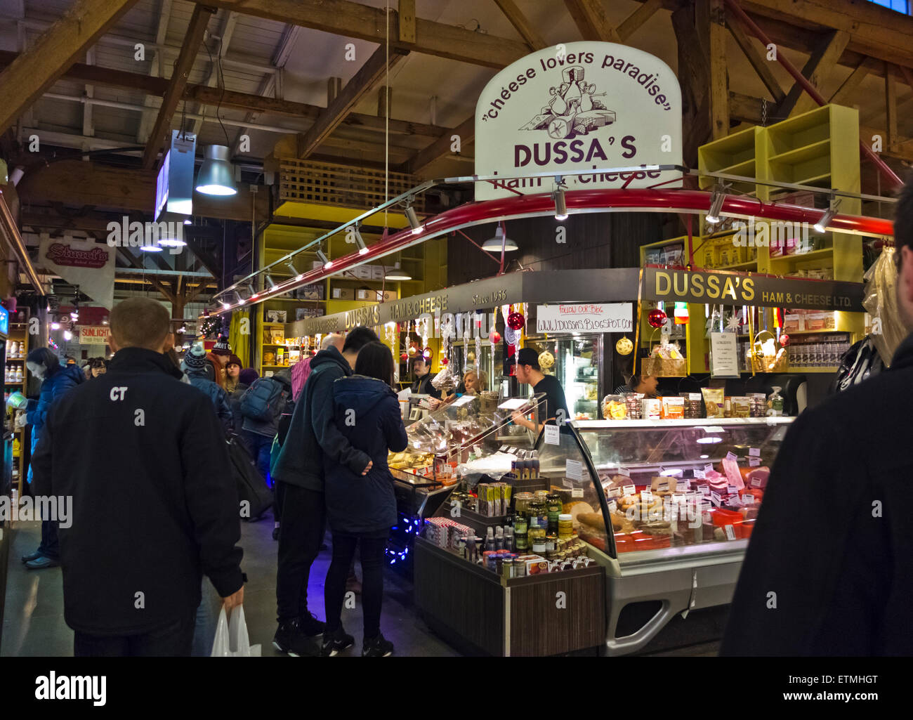 Dussa's cheeses and deli at Granville Island Public Market.  Vancouver, British Columbia Canada.  People shopping, fresh food. Stock Photo